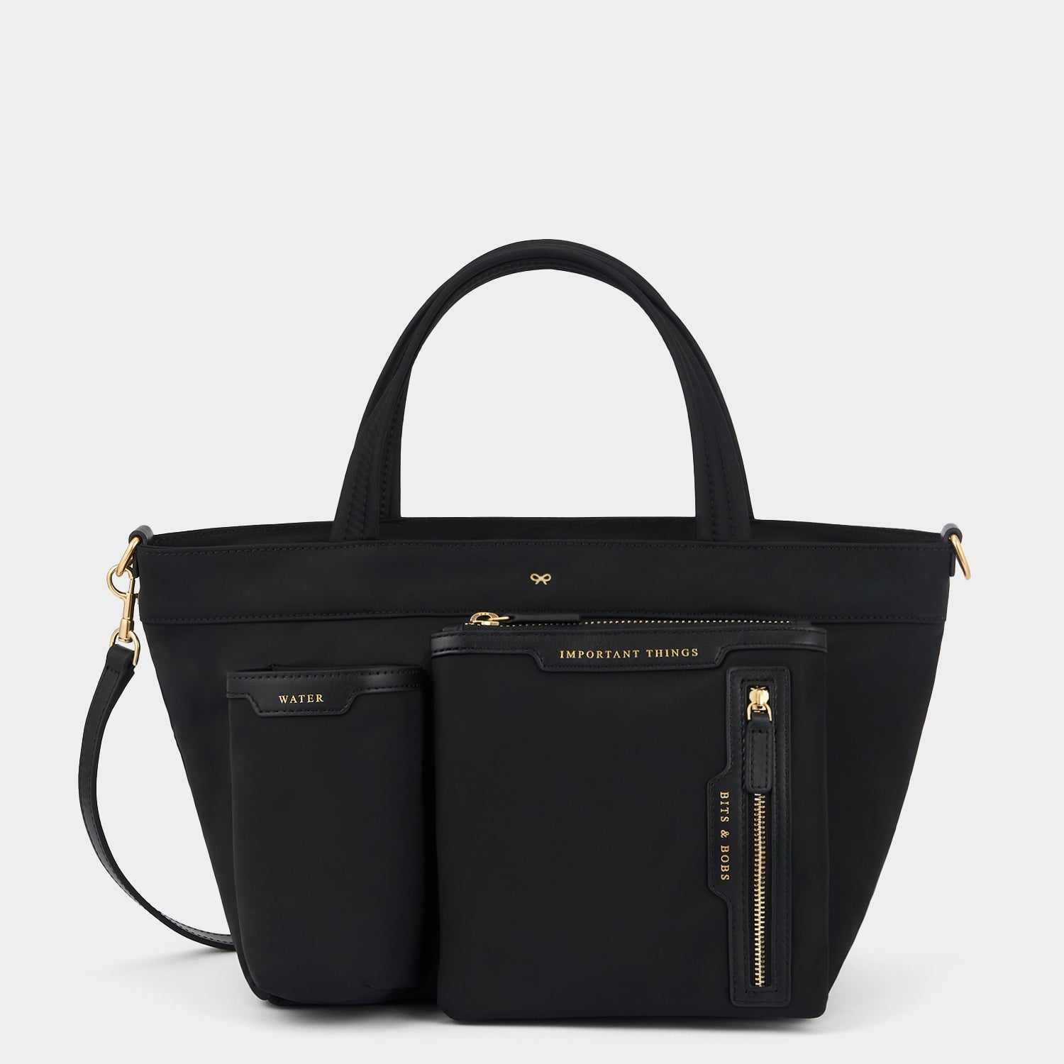 E/W Multi Pocket Mini Cross-body Tote -

          
            Regenerated ECONYL® in Black -
          

          Anya Hindmarch US
