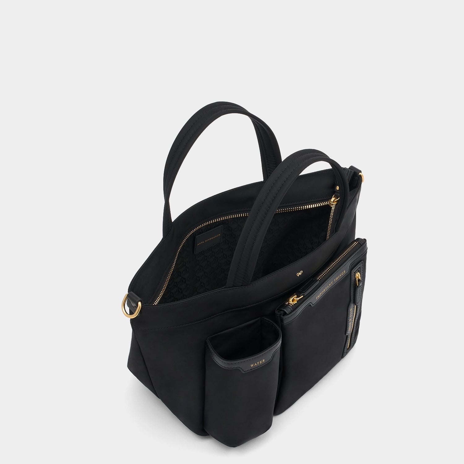 E/W Multi Pocket Mini Cross-body Tote -

          
            Regenerated ECONYL® in Black -
          

          Anya Hindmarch US
