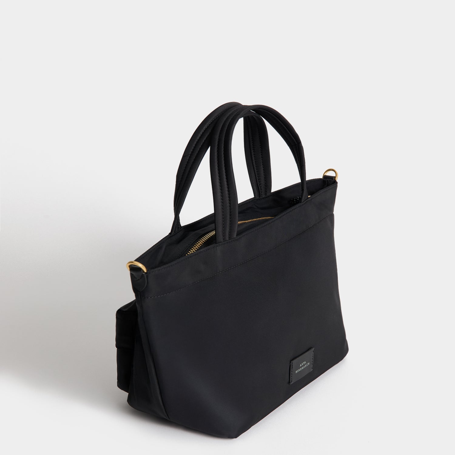 E/W Eyes Mini Cross-body Tote -

          
            Regenerated ECONYL® in Black -
          

          Anya Hindmarch US
