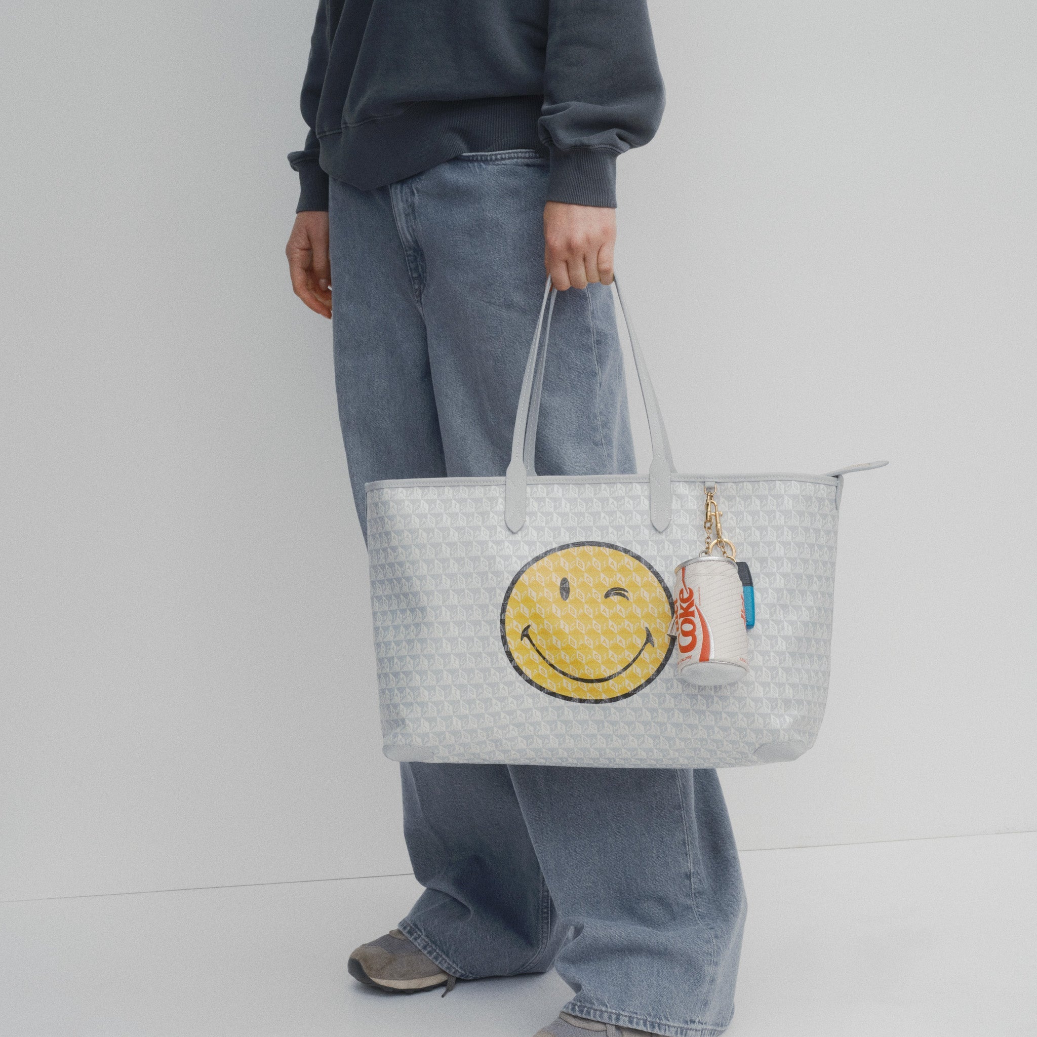 I Am A Plastic Bag Wink Zipped Tote -

          
            Recycled Canvas in Frost -
          

          Anya Hindmarch US
