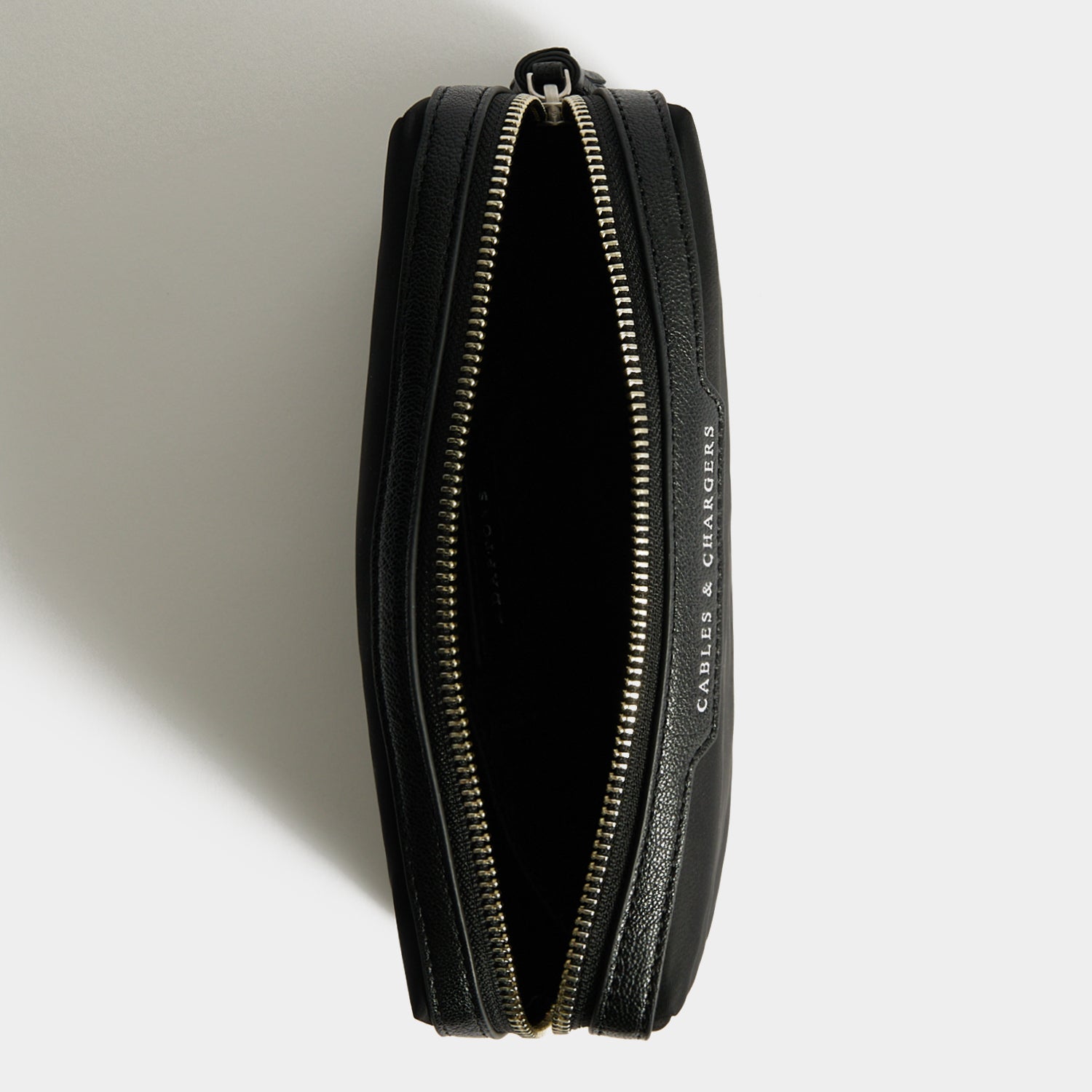 Cables & Chargers Pouch -

          
            Regenerated ECONYL® in Black -
          

          Anya Hindmarch US
