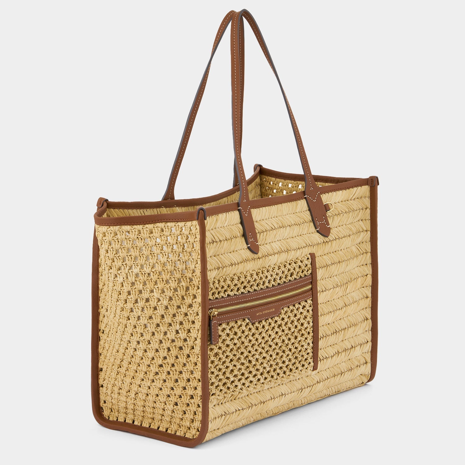 Raffia Pocket Tote -

          
            Raffia in Cedar -
          

          Anya Hindmarch US
