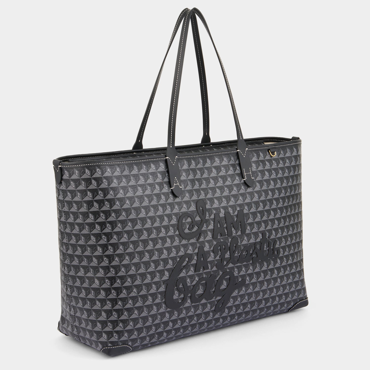I Am A Plastic Bag Zipped Motif Tote -

          
            Recycled Canvas in Black -
          

          Anya Hindmarch US
