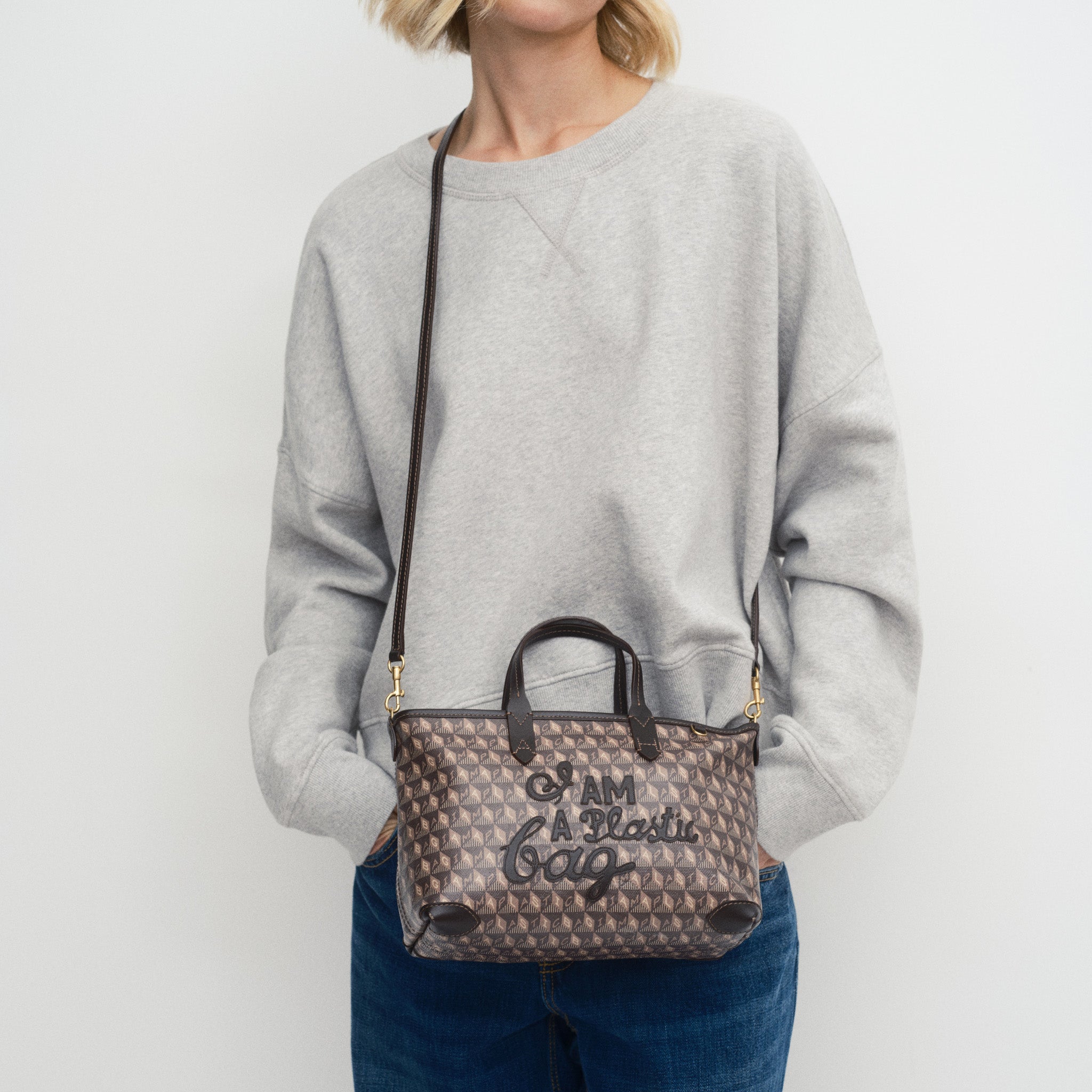 I Am A Plastic Bag XS Zipped Motif Cross-body Tote -

          
            Recycled Canvas in Truffle -
          

          Anya Hindmarch US
