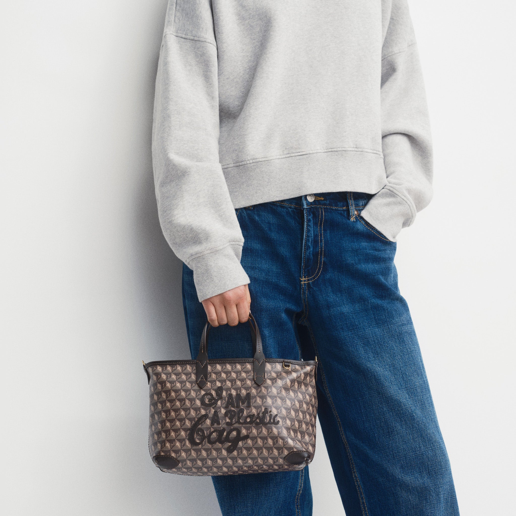 I Am A Plastic Bag XS Zipped Motif Cross-body Tote -

          
            Recycled Canvas in Truffle -
          

          Anya Hindmarch US
