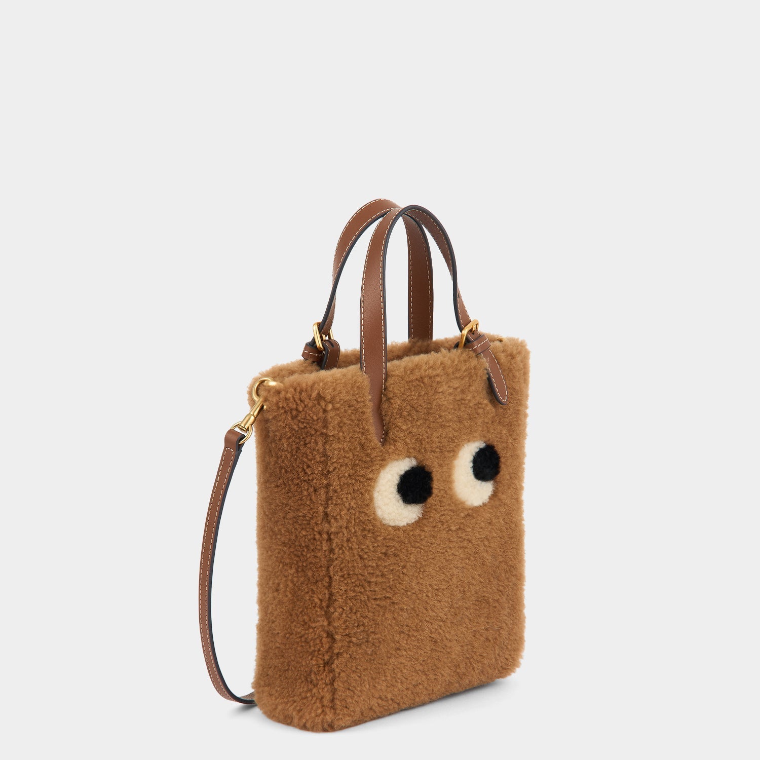 Mini N/S Eyes Shearling Cross-body Tote -

          
            Shearling in Sepia -
          

          Anya Hindmarch US
