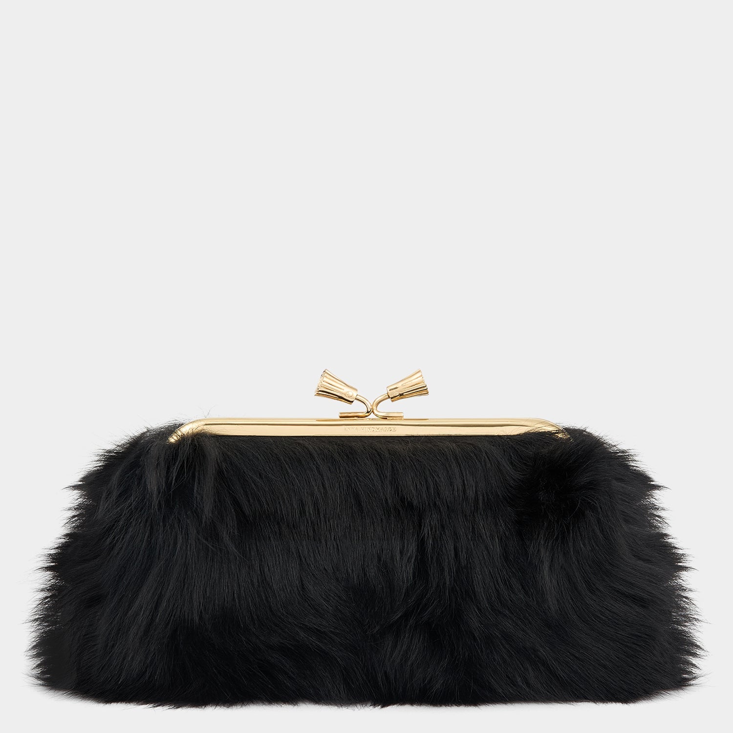 Maud Shearling Tassel Clutch -

          
            Shearling in Black -
          

          Anya Hindmarch US
