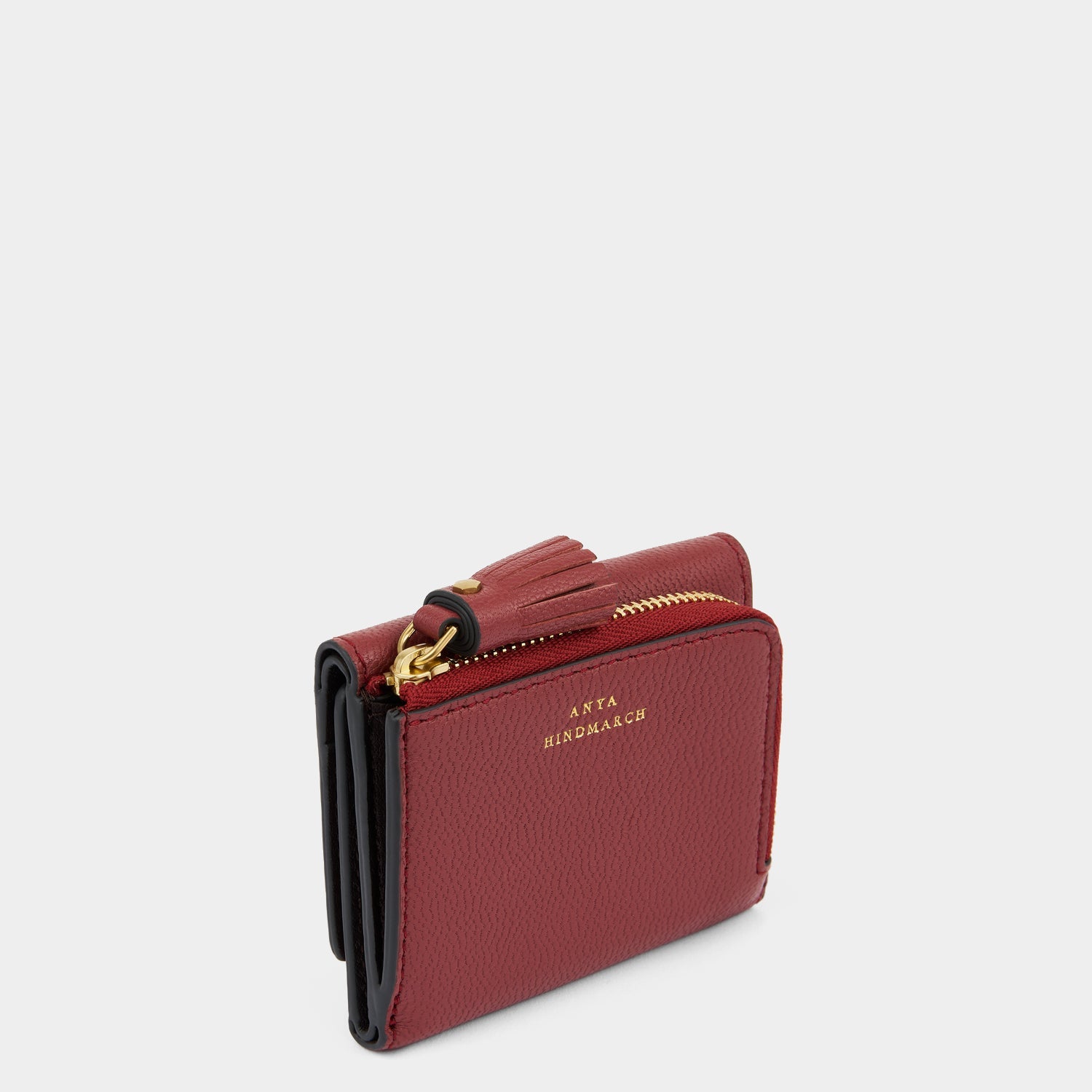 Peeping Eyes Mini Trifold Wallet -

          
            Capra Leather in Damson -
          

          Anya Hindmarch US
