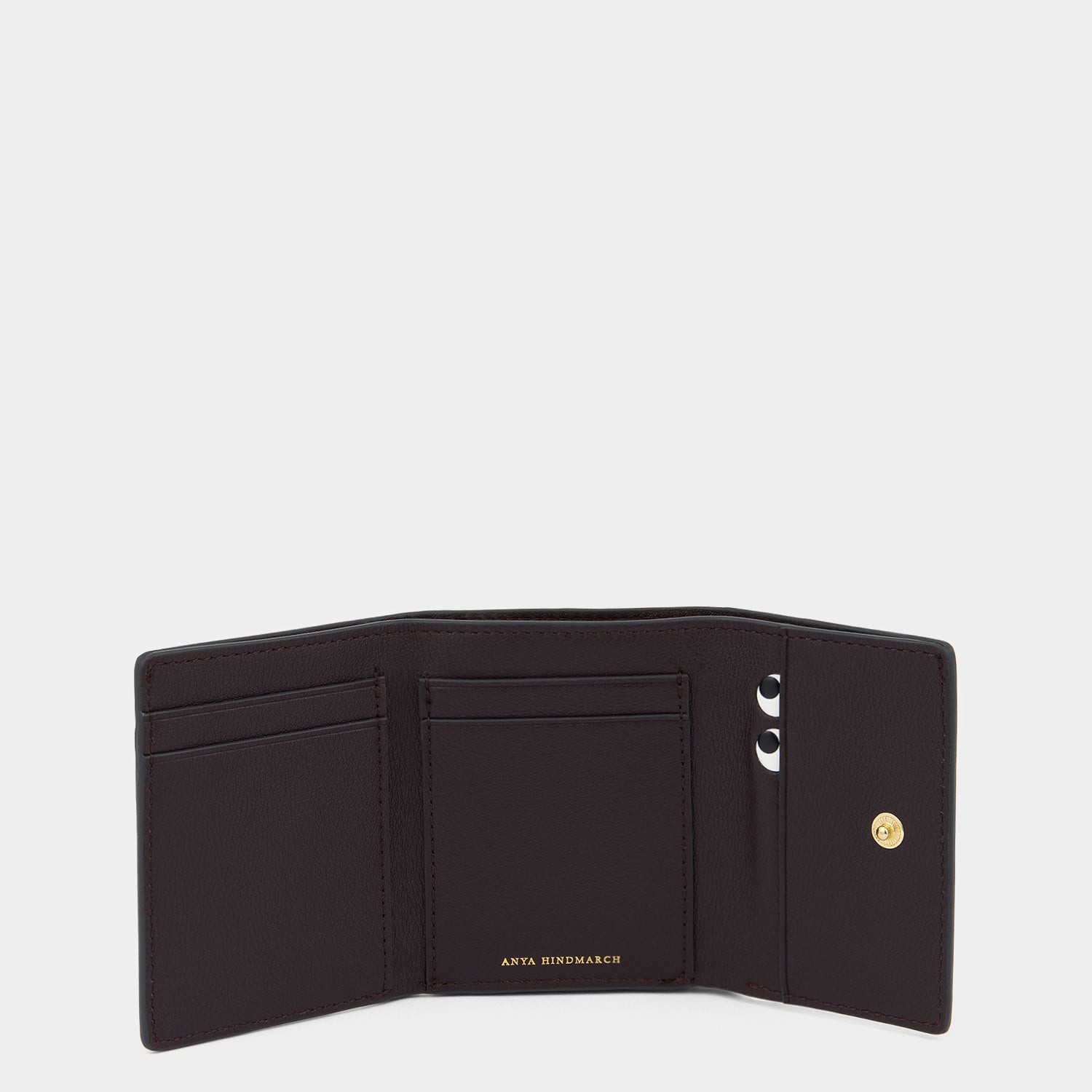 Peeping Eyes Mini Trifold Wallet -

          
            Capra Leather in Damson -
          

          Anya Hindmarch US
