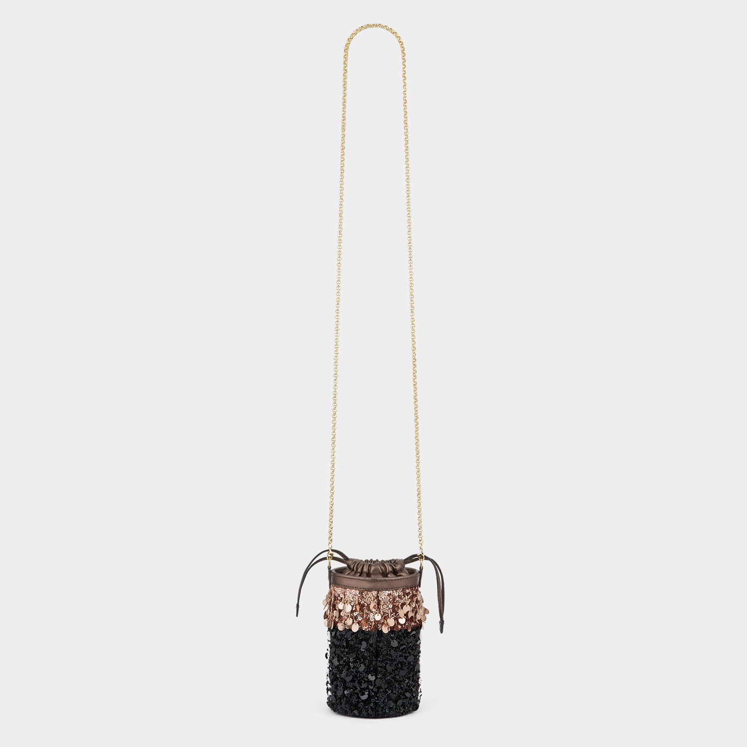 Anya Brands Duracell Mini Bucket Bag -

          
            Sequins in Black -
          

          Anya Hindmarch US
