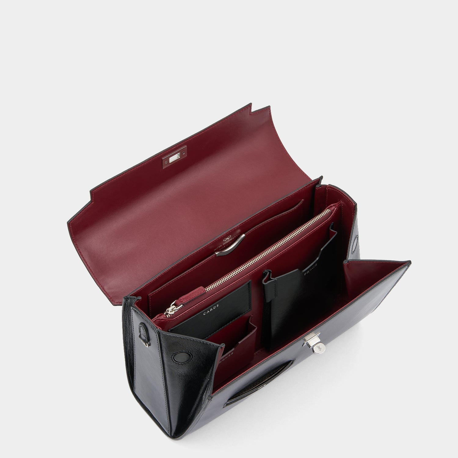 Mortimer Top Handle -

          
            Calf Leather in Glossy Black -
          

          Anya Hindmarch US
