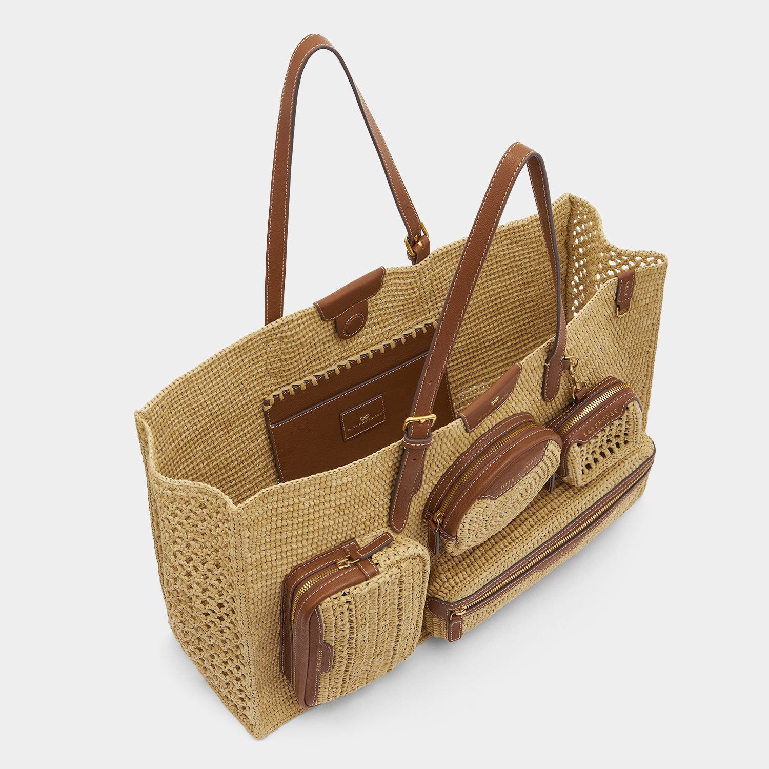 E/W Raffia Holiday Tote -

          
            Raffia in Natural -
          

          Anya Hindmarch US
