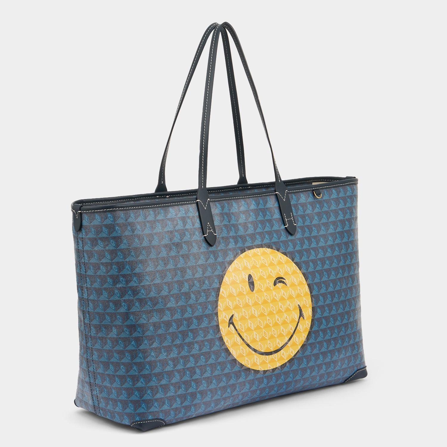 I am a Plastic Bag Wink Zipped Tote -

          
            Recycled Canvas in Marine -
          

          Anya Hindmarch US
