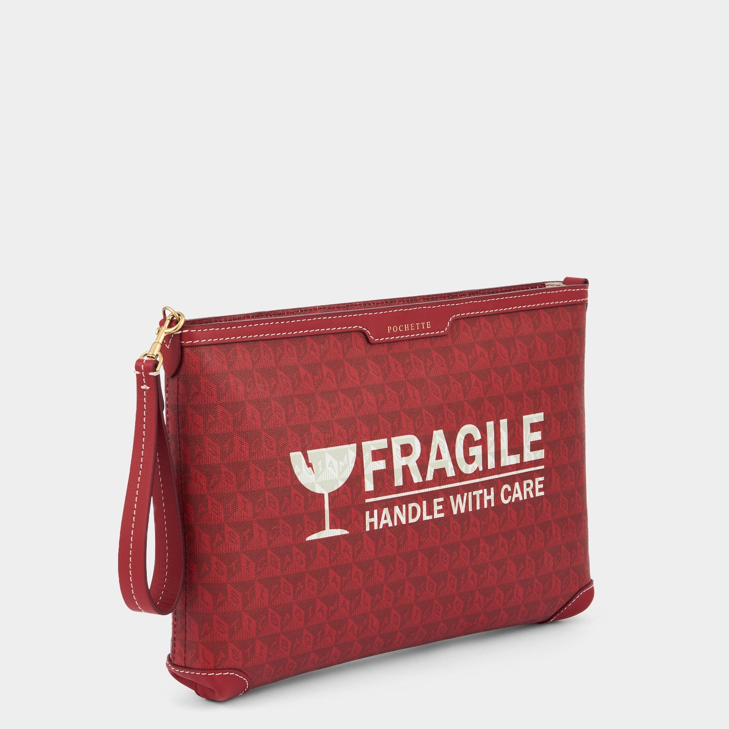 Fragile I am a Plastic Bag Pochette -

          
            Recycled Canvas in Vampire -
          

          Anya Hindmarch US
