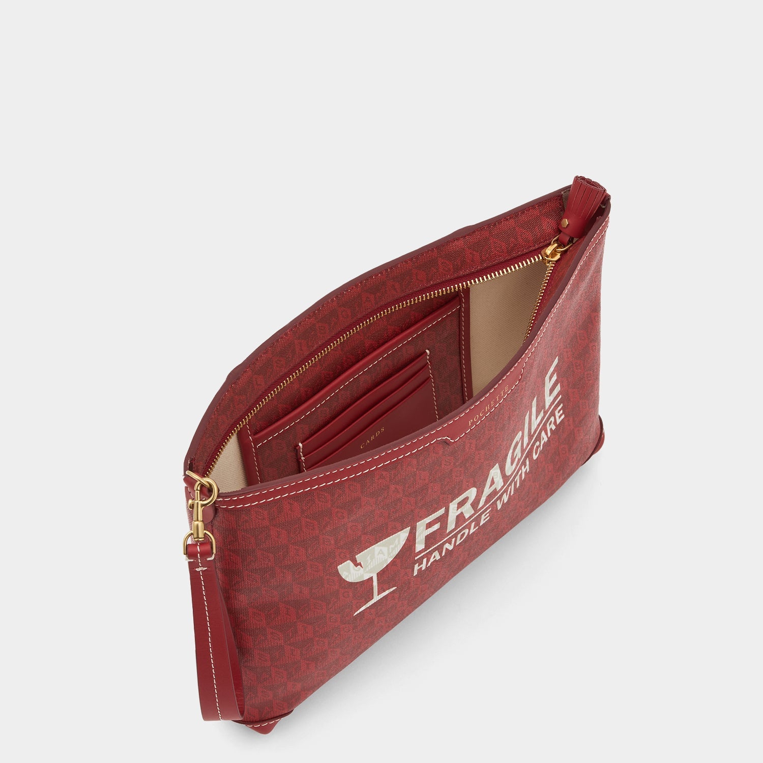 Fragile I am a Plastic Bag Pochette -

          
            Recycled Canvas in Vampire -
          

          Anya Hindmarch US
