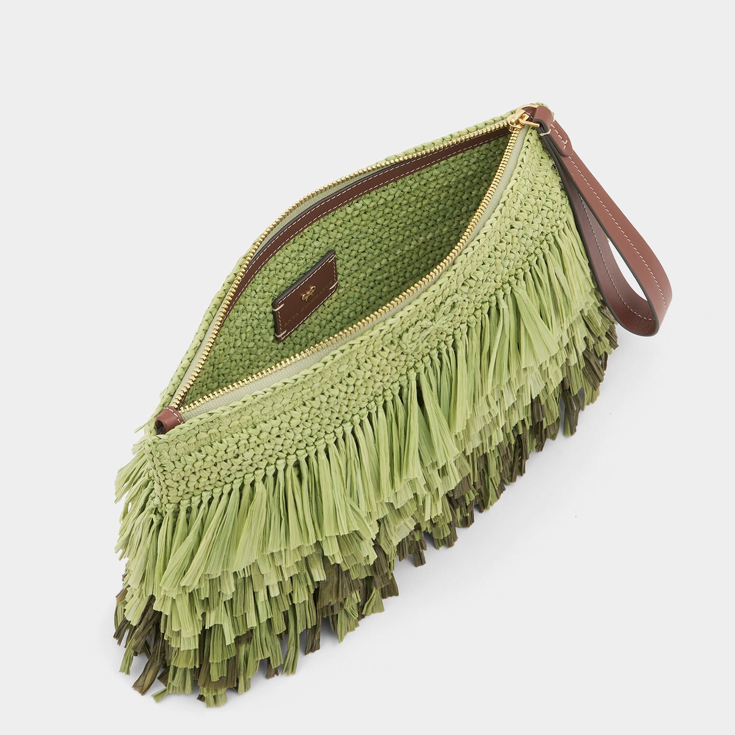 Green raffia clutch bag by Anya Hindmarch
