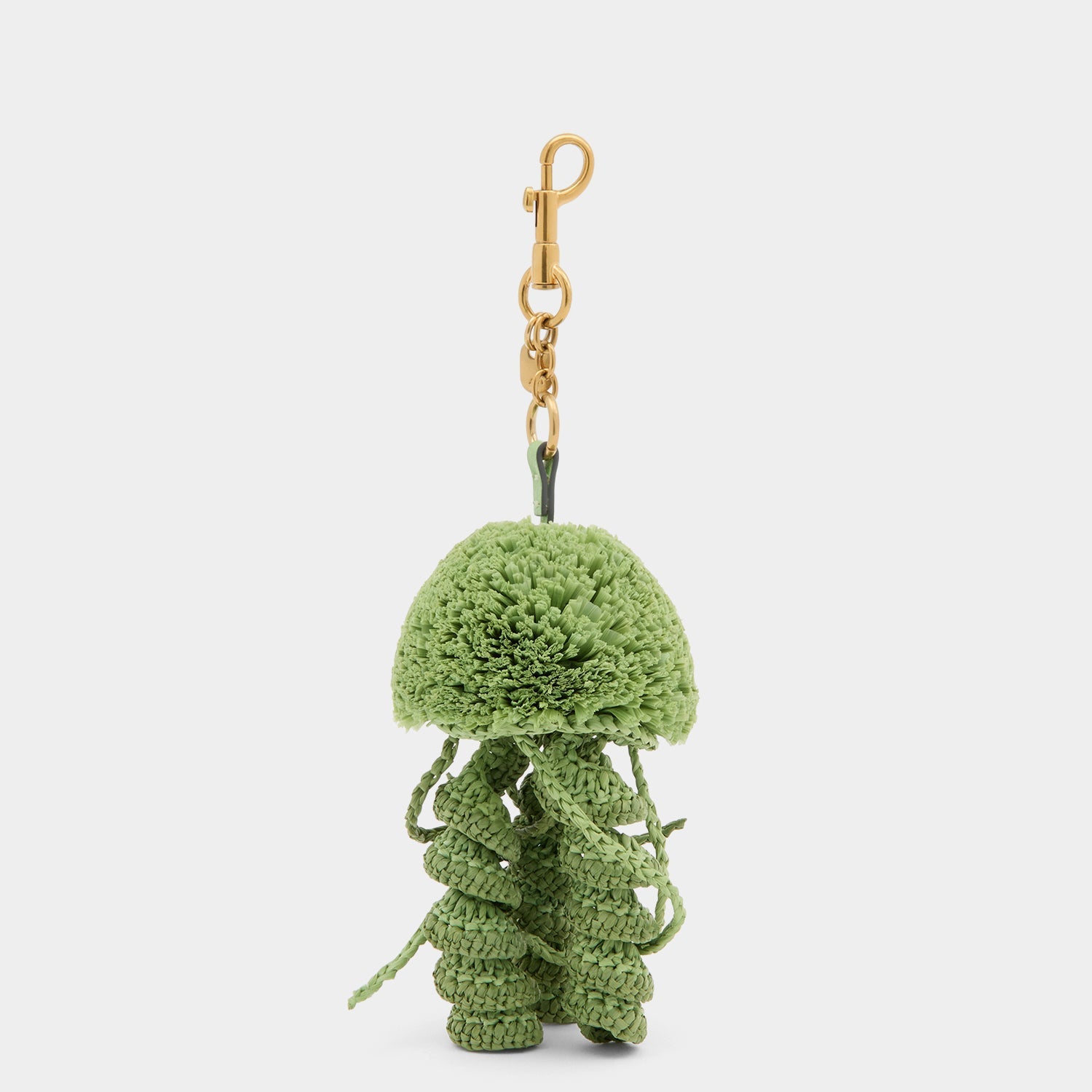 Green jellyfish charm made of raffia by Anya Hindmarch