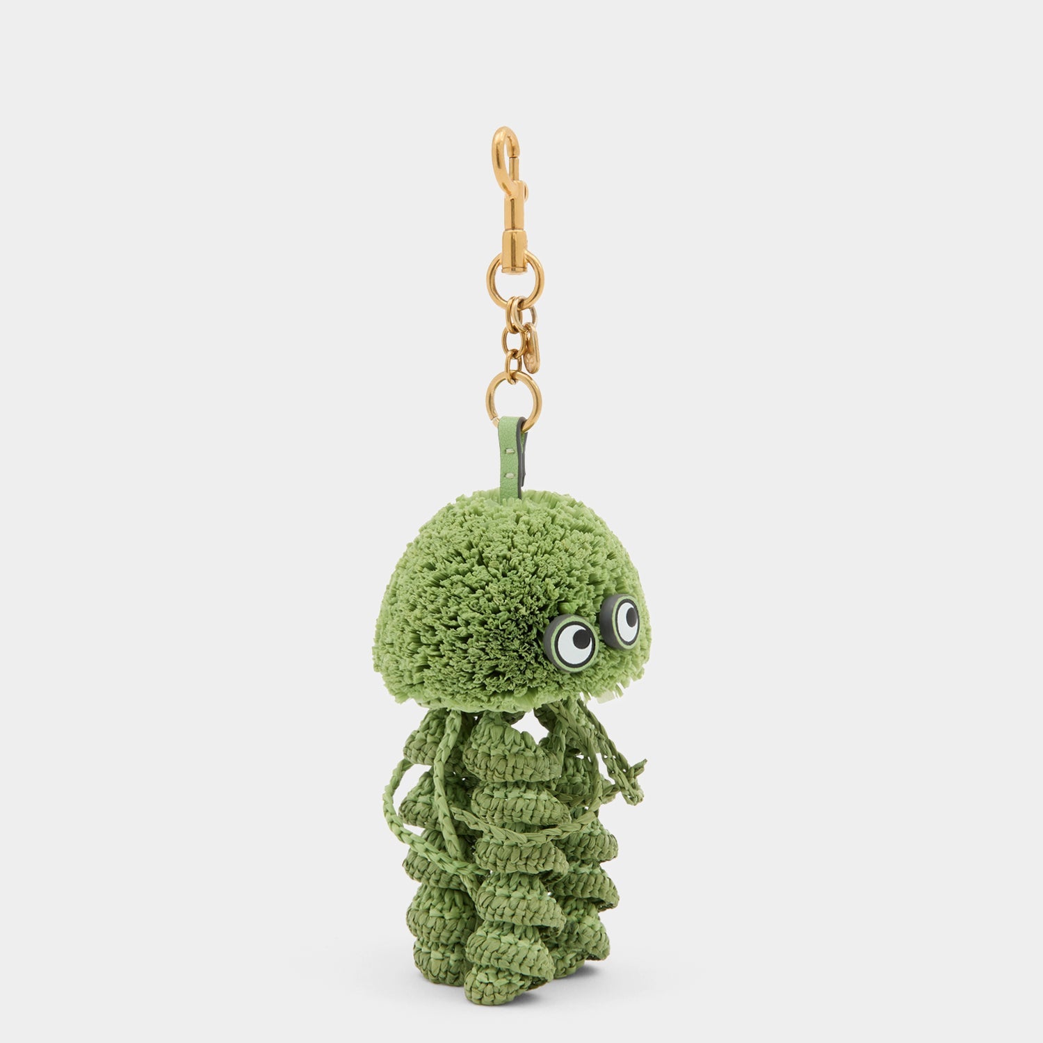 Green jellyfish charm made of raffia by Anya Hindmarch