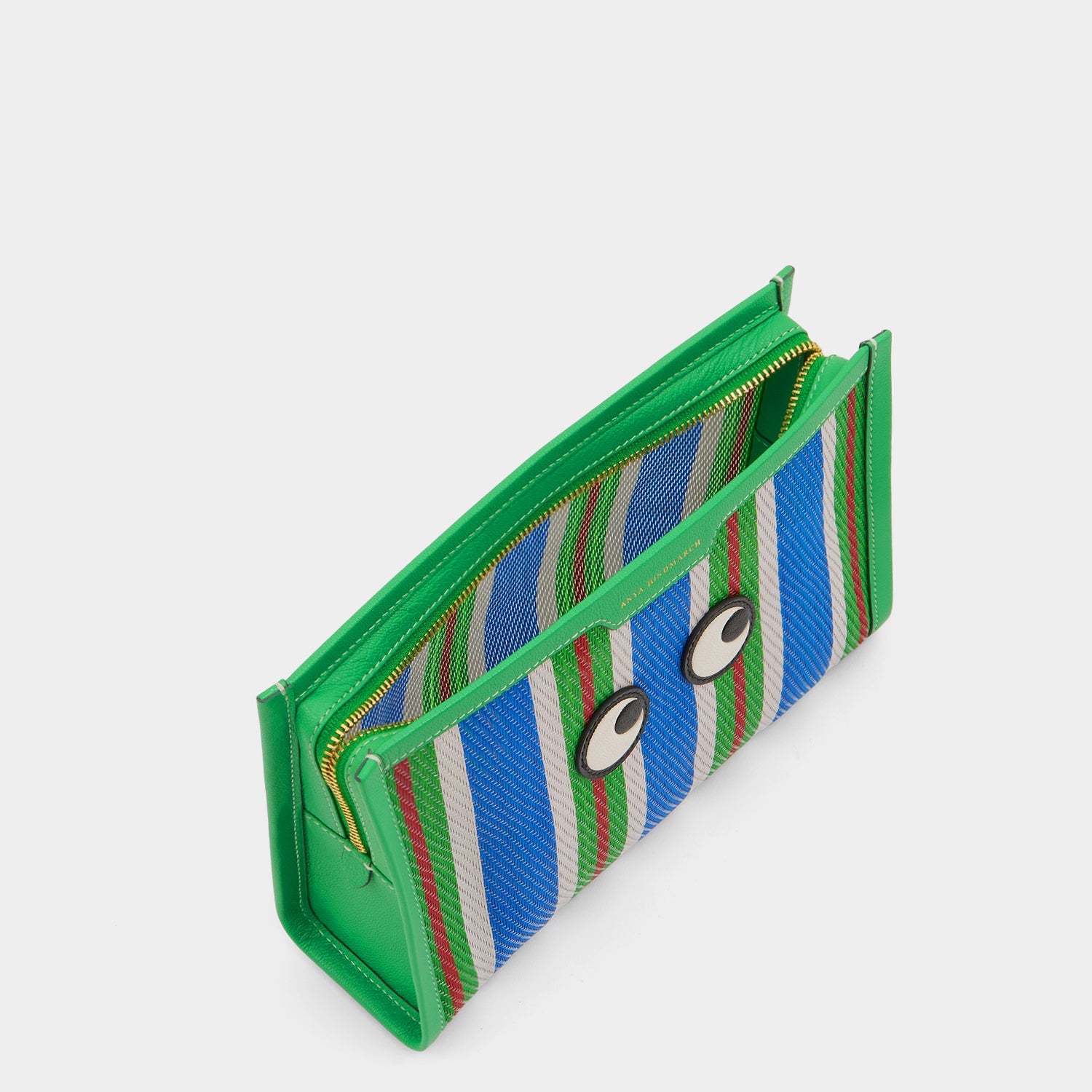 Striped pouch made of goat leather and featuring googly eyes by Anya Hindmarch