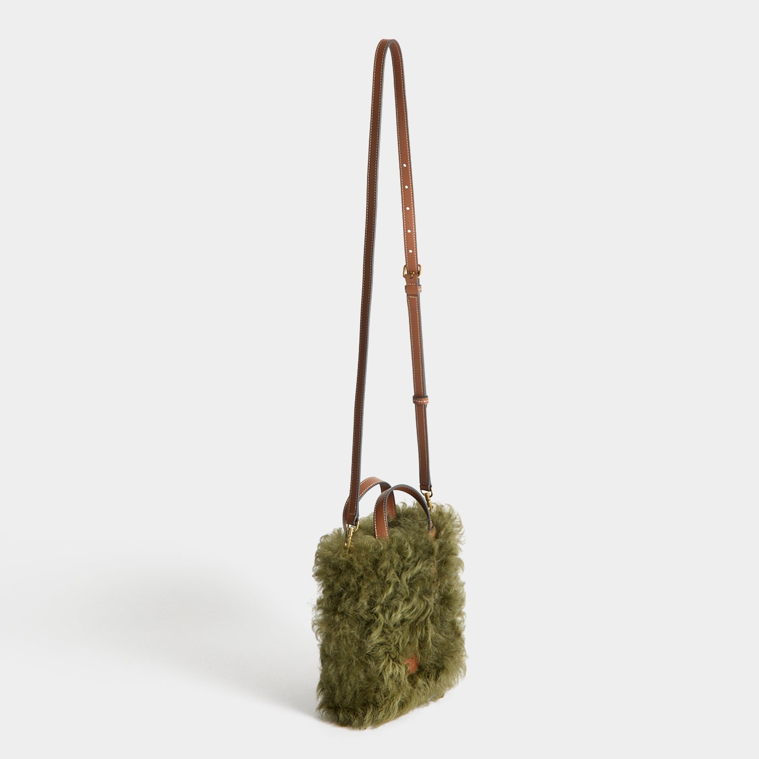 N/S Mini Eyes Shearling Tote -

          
            Shearling/Smooth Leather in Khaki Green -
          

          Anya Hindmarch US

