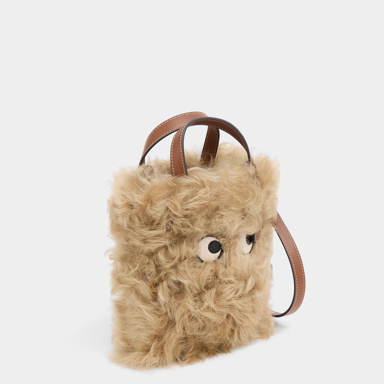 N/S Mini Eyes Shearling Tote -

          
            Shearling/Smooth Leather in Taupe -
          

          Anya Hindmarch US
