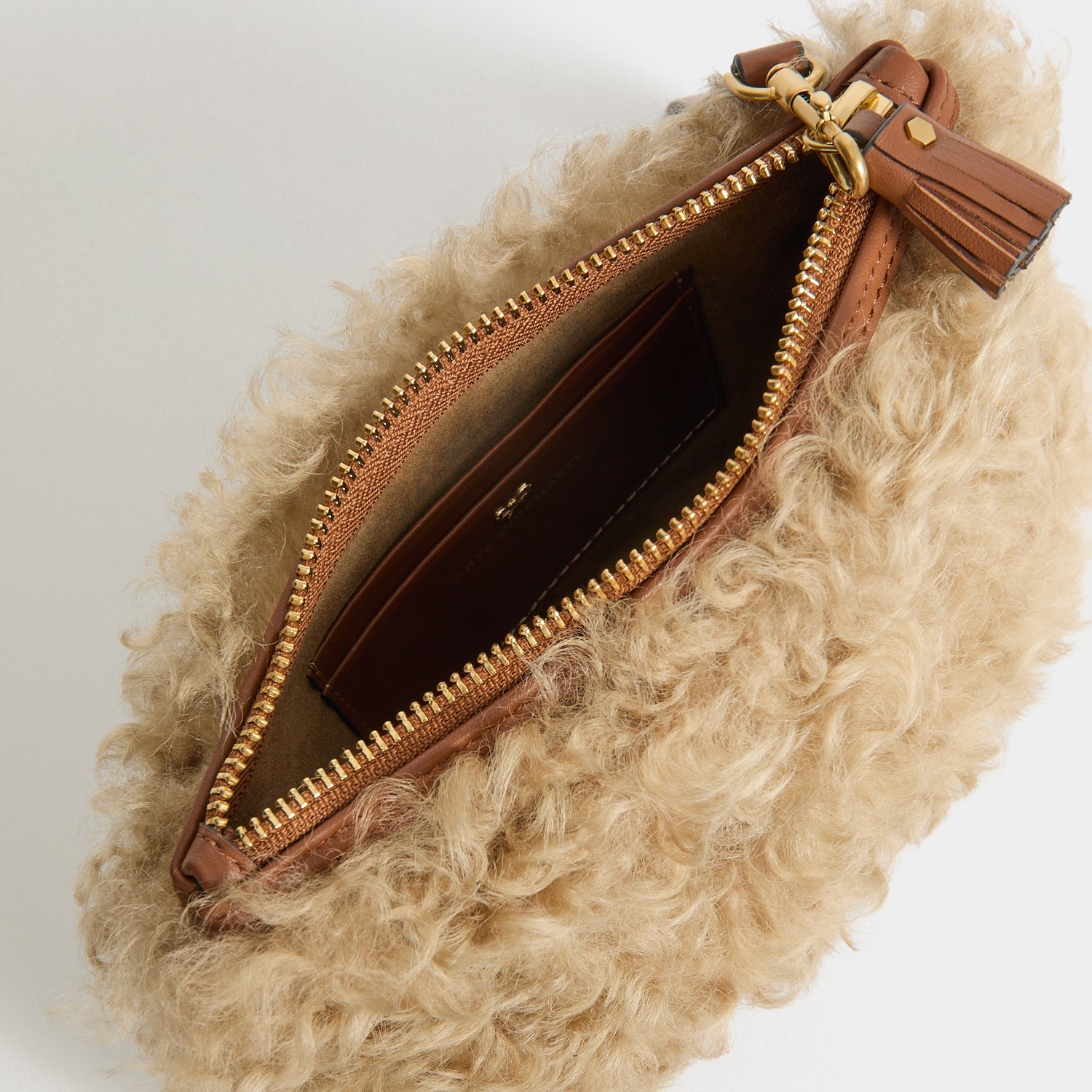 Shearling Eyes Clutch -

          
            Shearling/Smooth Leather leather in Taupe -
          

          Anya Hindmarch US
