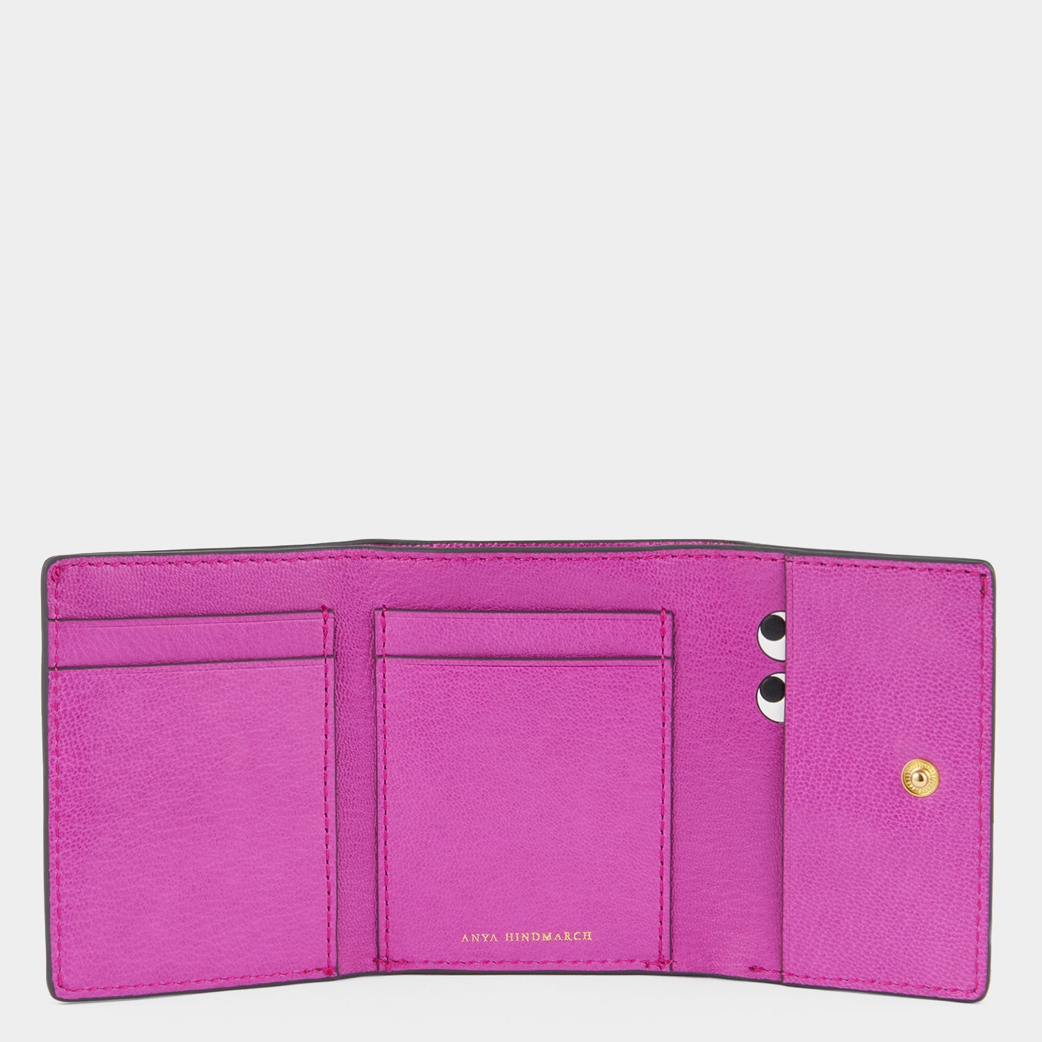 Purple leather trifold wallet by Anya Hindmarch