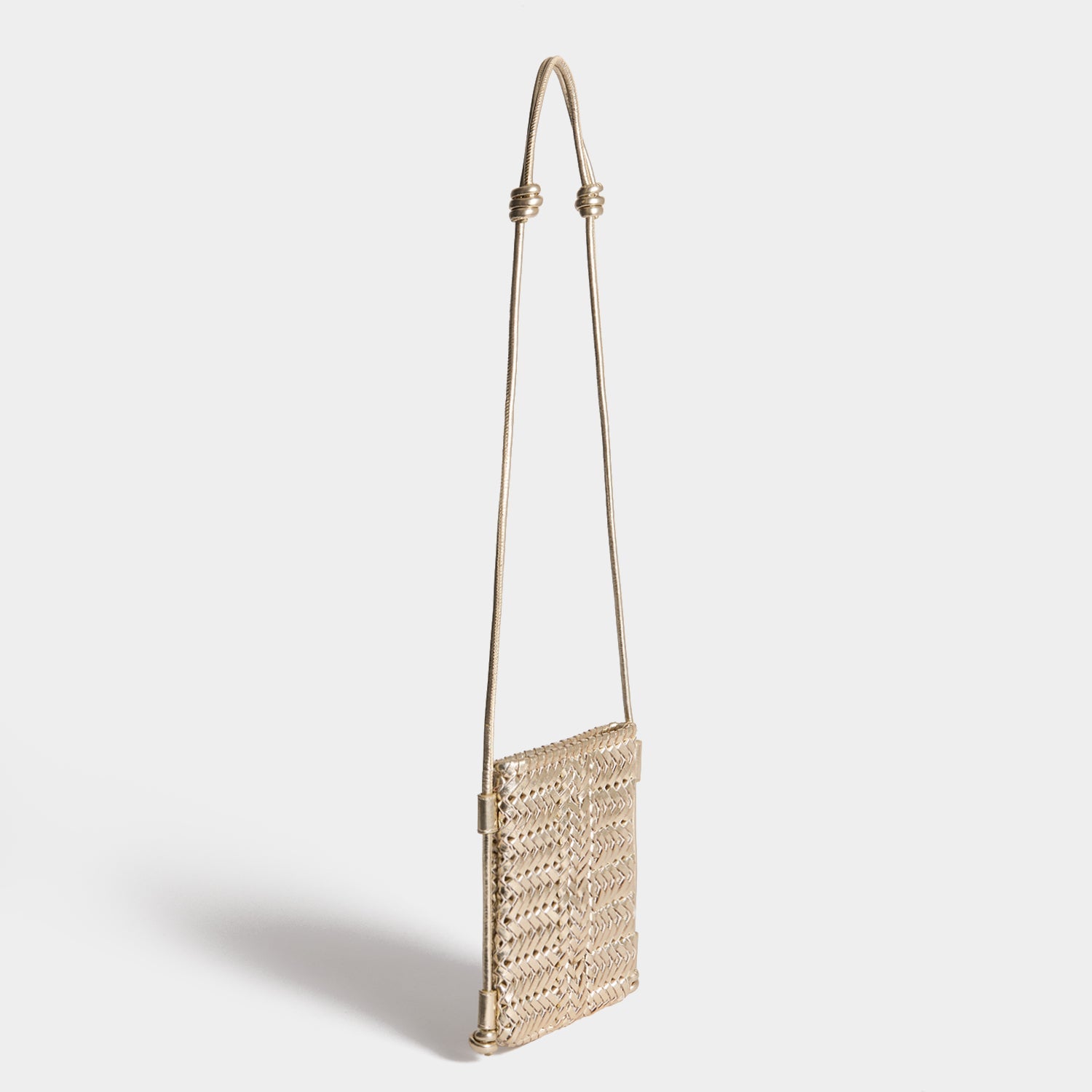 Neeson Cross-body Pouch -

          
            Capra Leather in Platino Gold -
          

          Anya Hindmarch US
