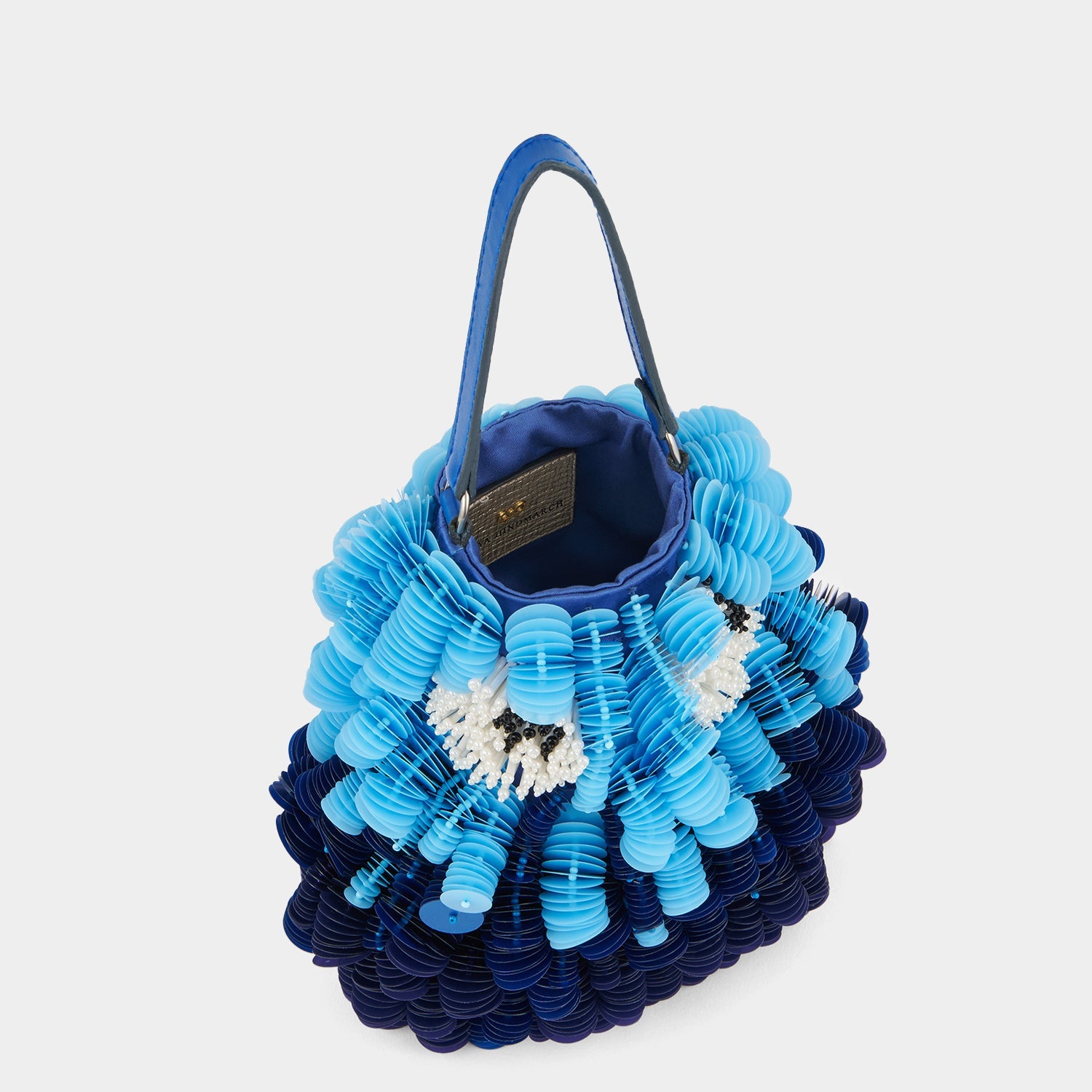 Blue beaded crossbody bag shaped like a fish by Anya Hindmarch