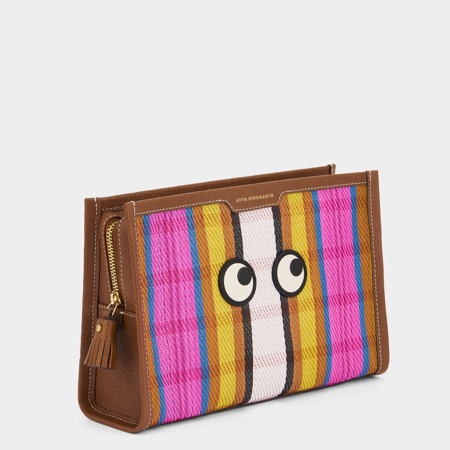 Pouch made with striped recycled mesh and grainy goat leather with appliquéd Eyes motif by Anya Hindmarch