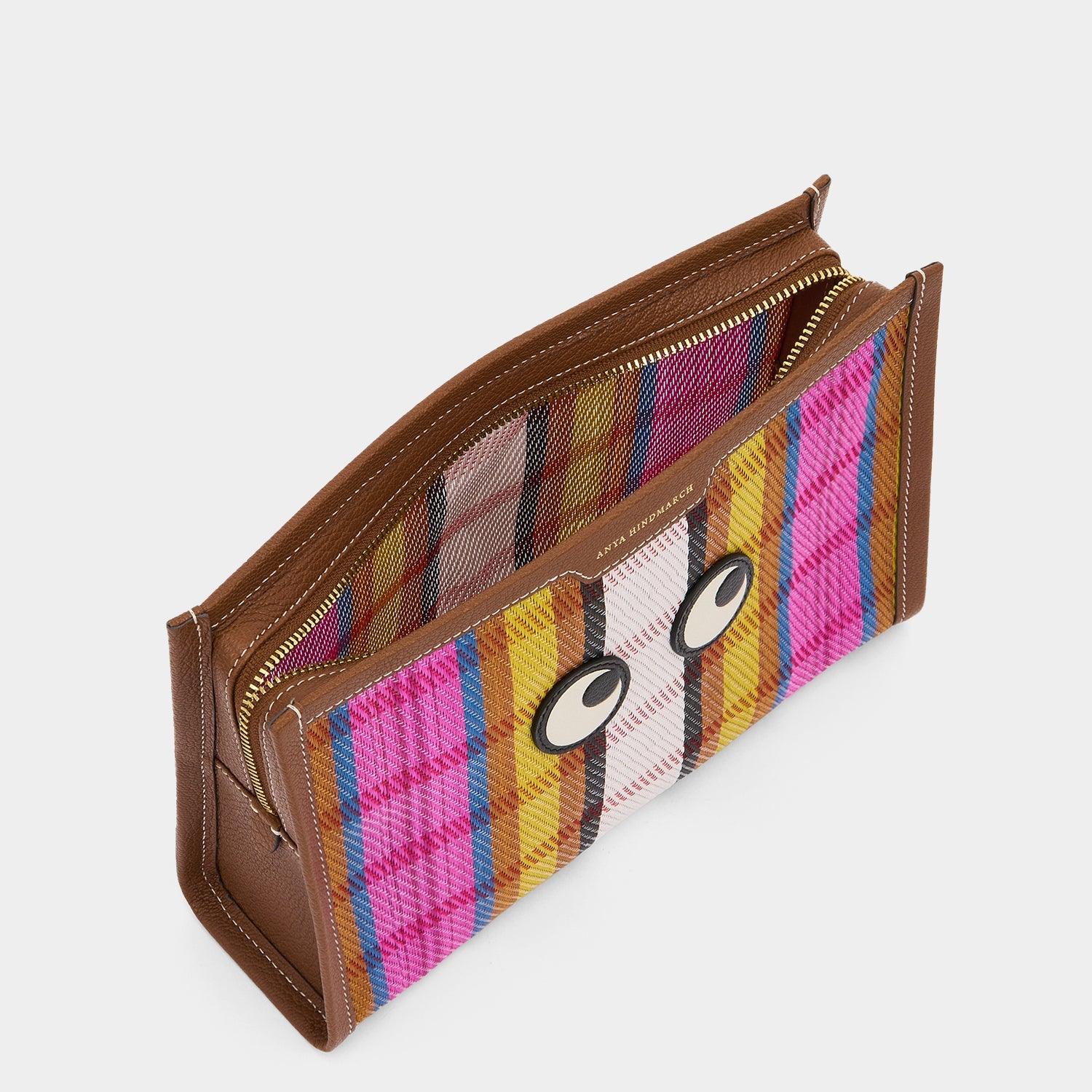 Pouch made with striped recycled mesh and grainy goat leather with appliquéd Eyes motif by Anya Hindmarch