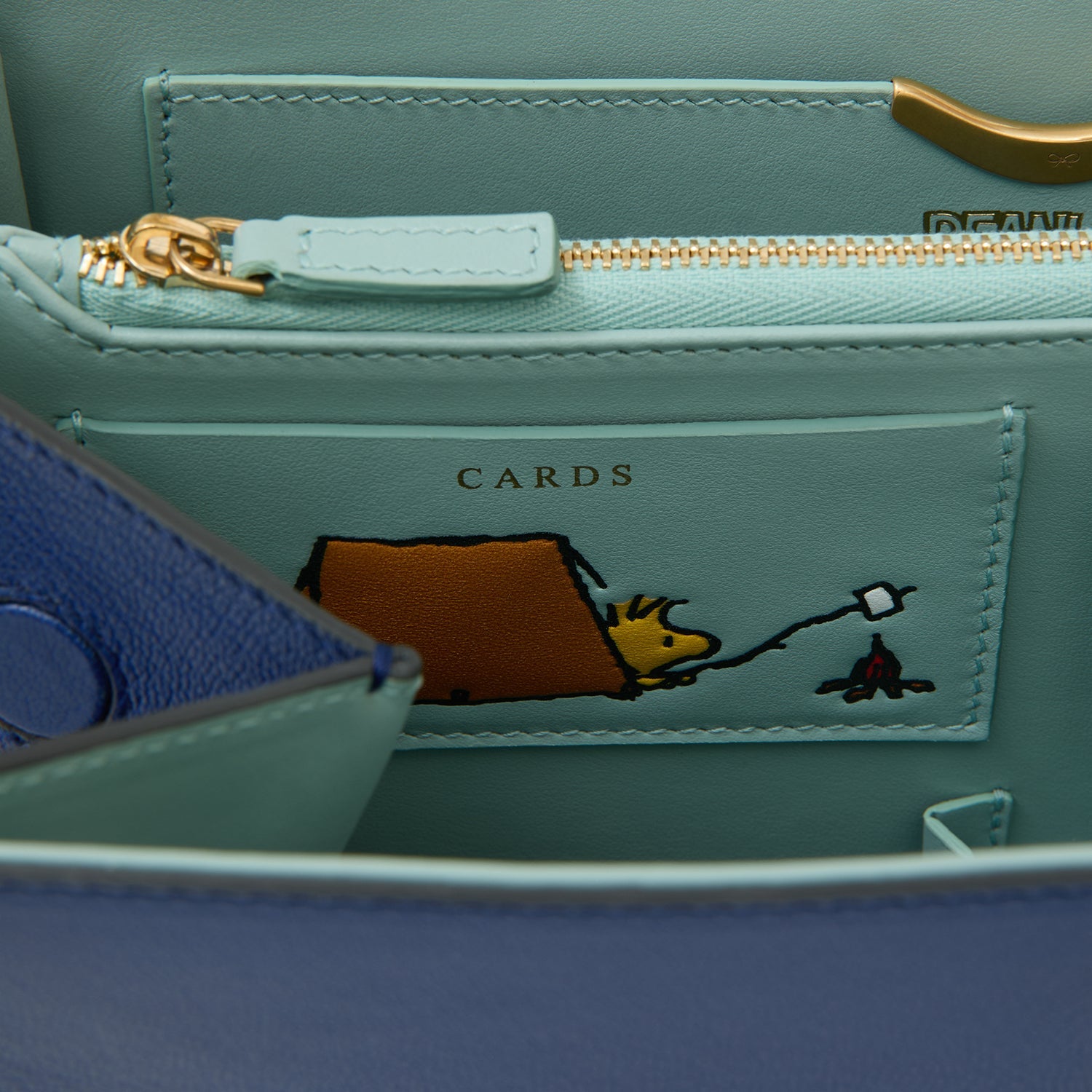 Peanuts Snoopy Mortimer Top Handle -

          
            Capra Leather in Monday Blue -
          

          Anya Hindmarch US
