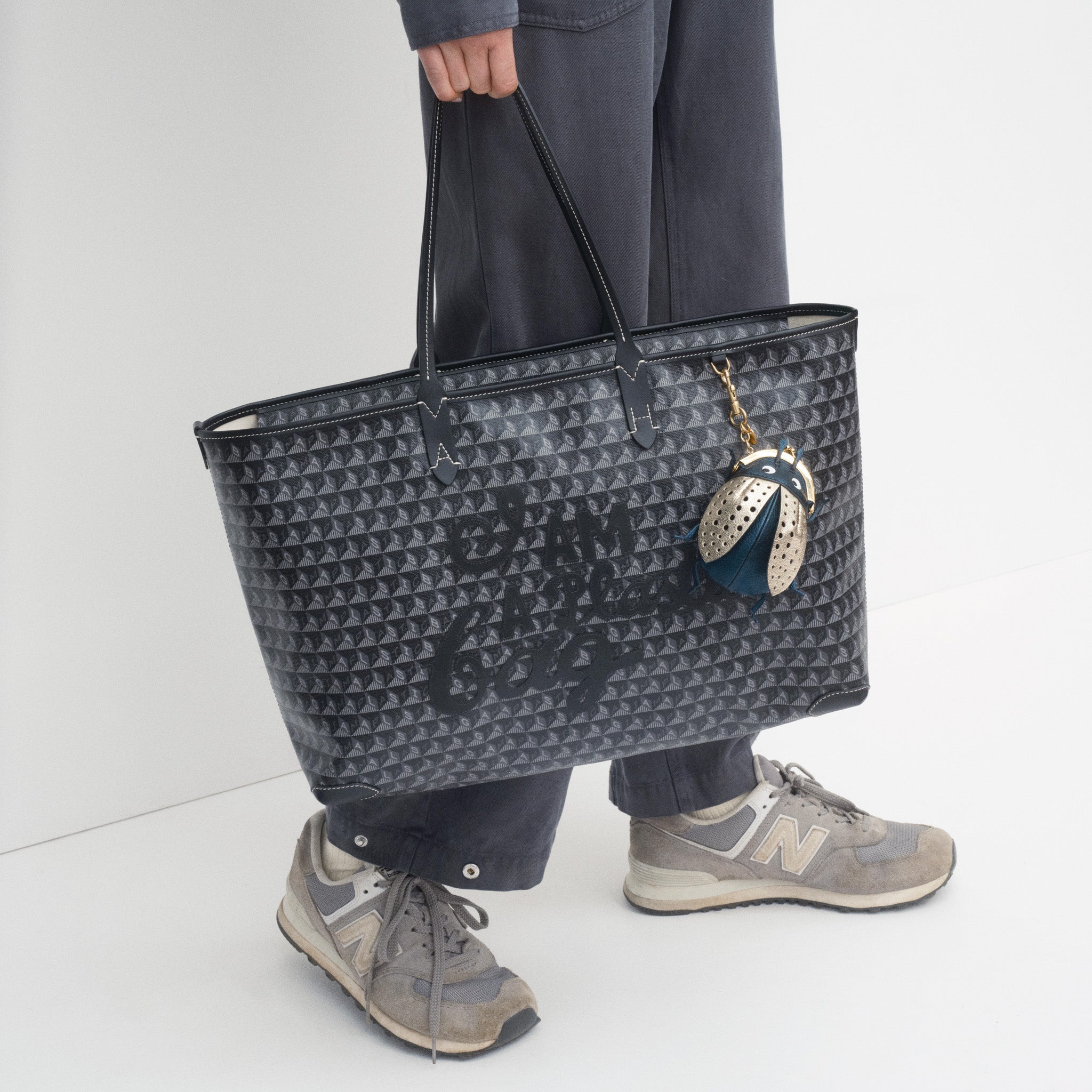 I Am A Plastic Bag Zipped Motif Tote -

          
            Recycled Canvas in Black -
          

          Anya Hindmarch US
