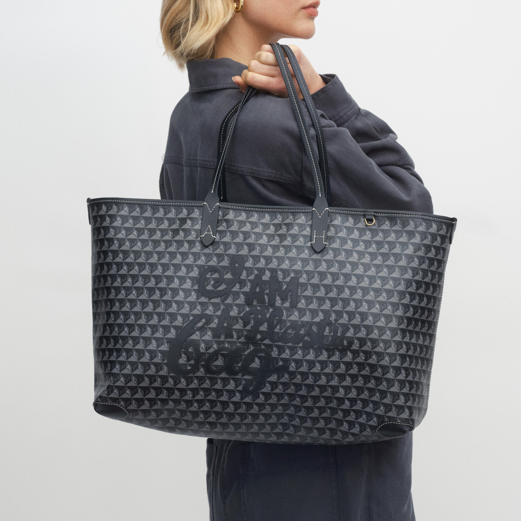 I Am A Plastic Bag Zipped Motif Tote -

          
            Recycled Canvas in Black -
          

          Anya Hindmarch US
