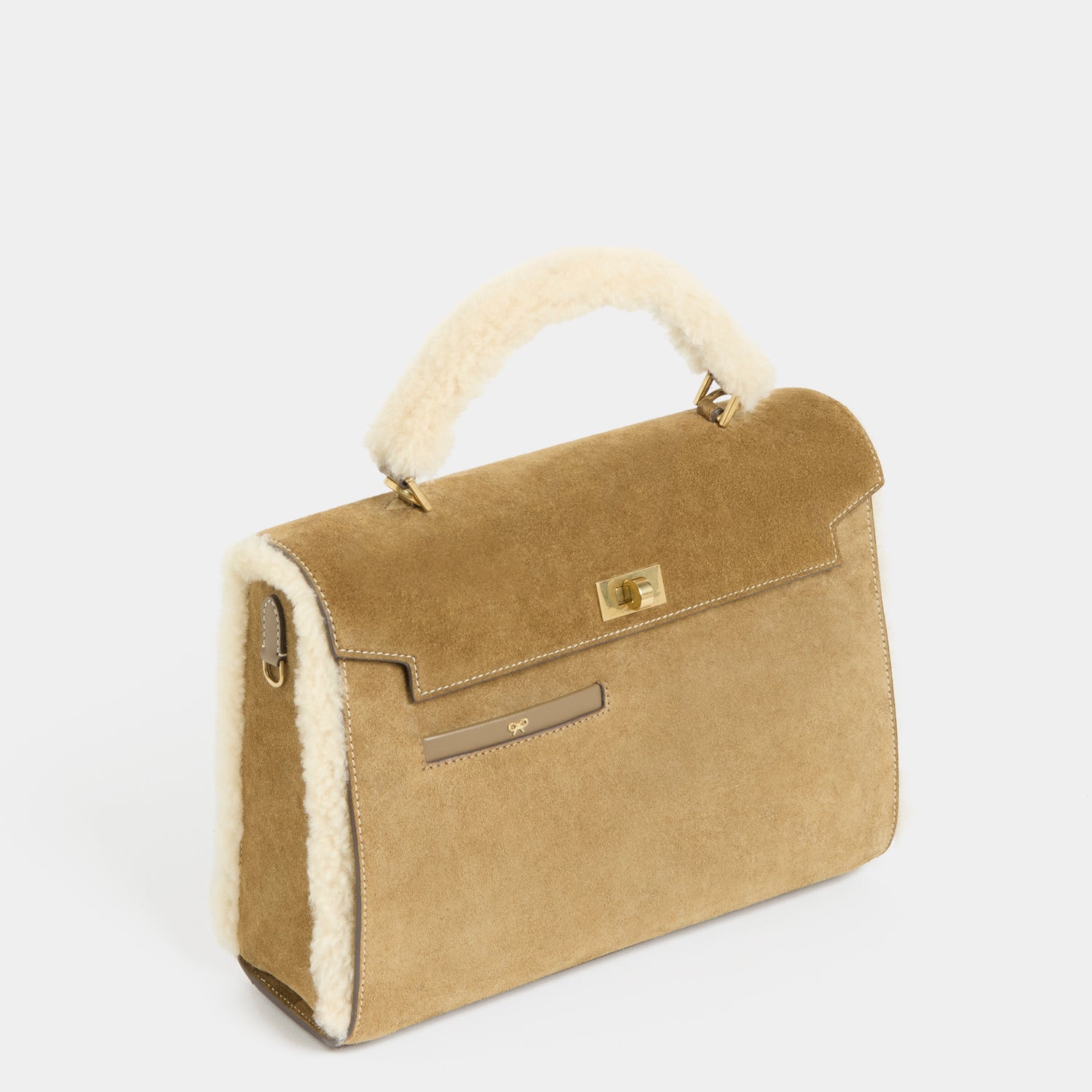 Mortimer Shearling Top Handle -

          
            Shearling/Suede Leather in Moutarde -
          

          Anya Hindmarch US
