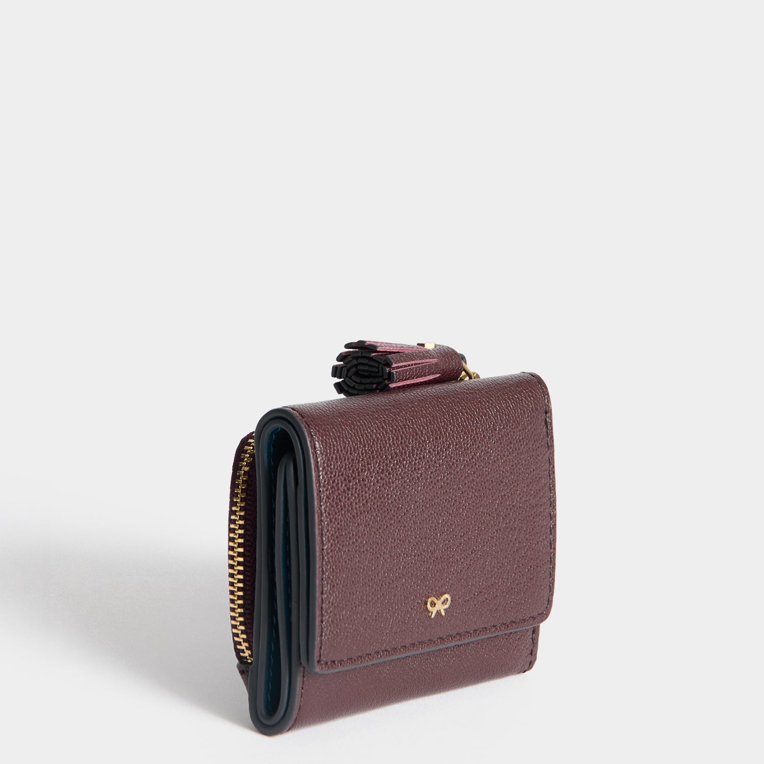 Peeping Eyes Mini Trifold Wallet -

          
            Capra Leather in Claret -
          

          Anya Hindmarch US
