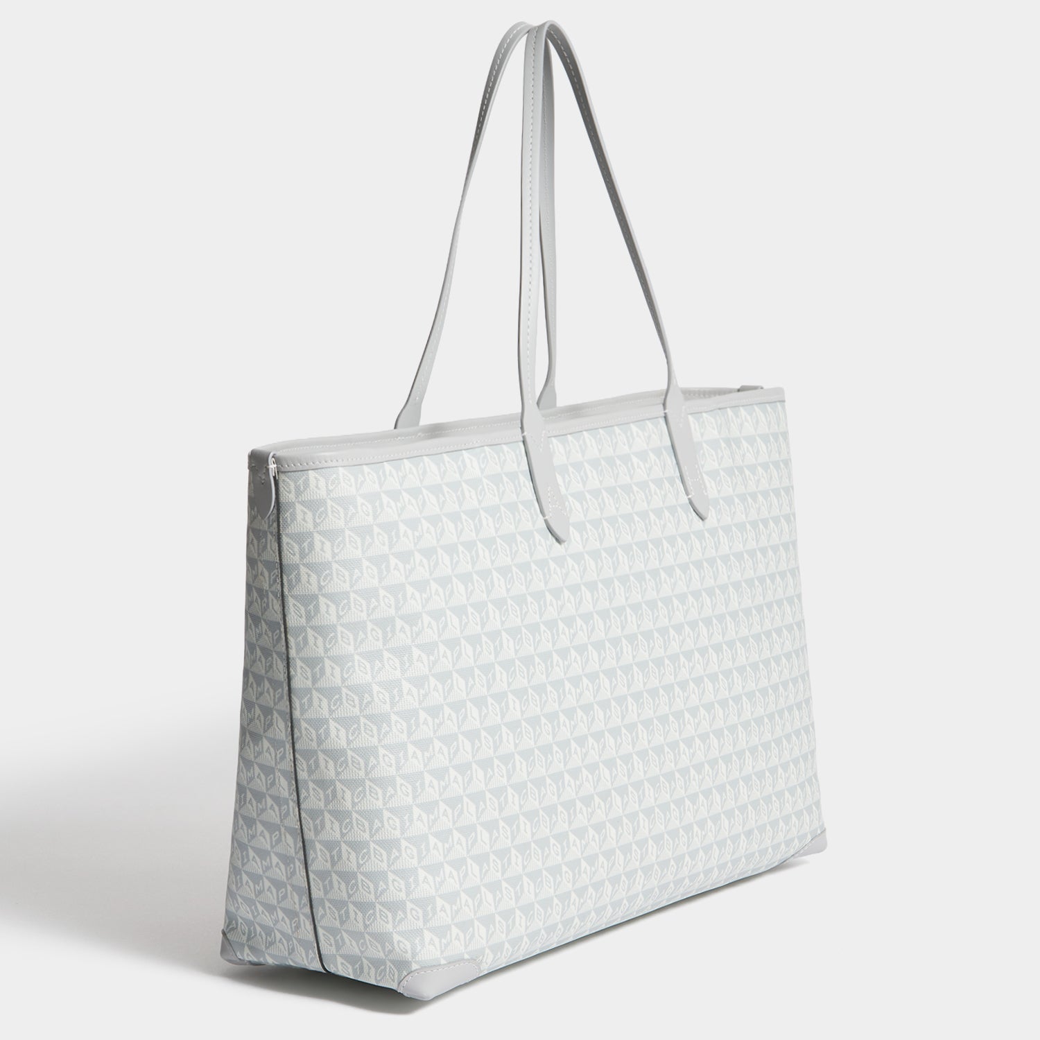 I Am A Plastic Bag Wink Zipped Tote -

          
            Recycled Canvas in Frost -
          

          Anya Hindmarch US

