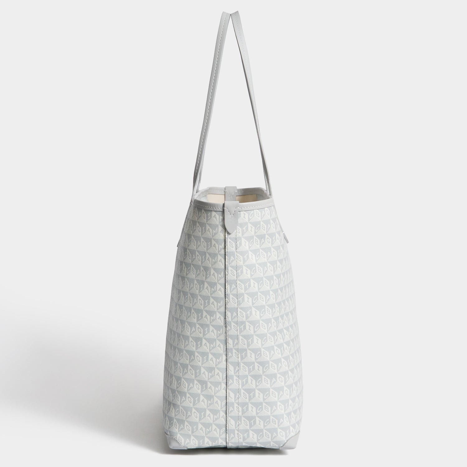 I Am A Plastic Bag Wink Zipped Tote -

          
            Recycled Canvas in Frost -
          

          Anya Hindmarch US
