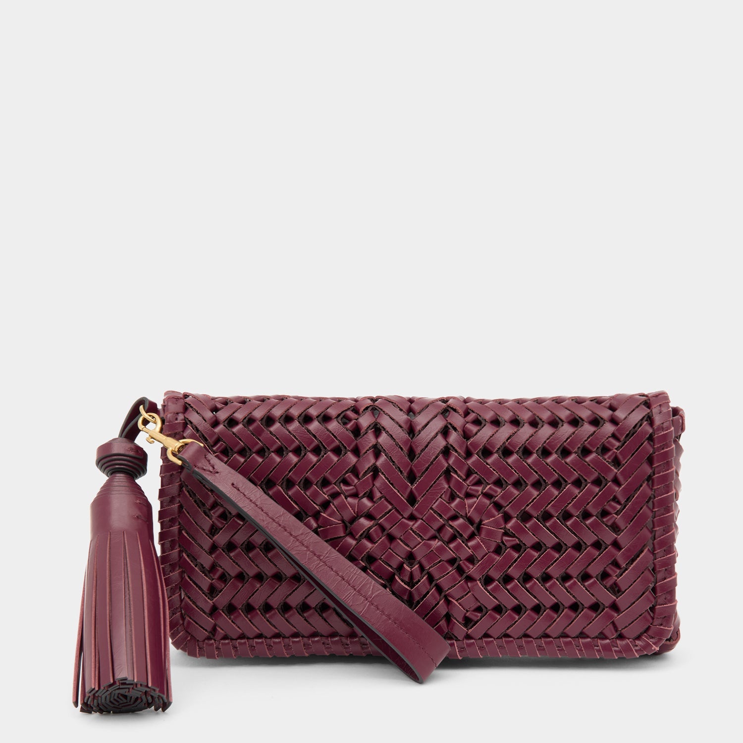 Handwoven leather clutch with adjustable strap by Anya Hindmarch