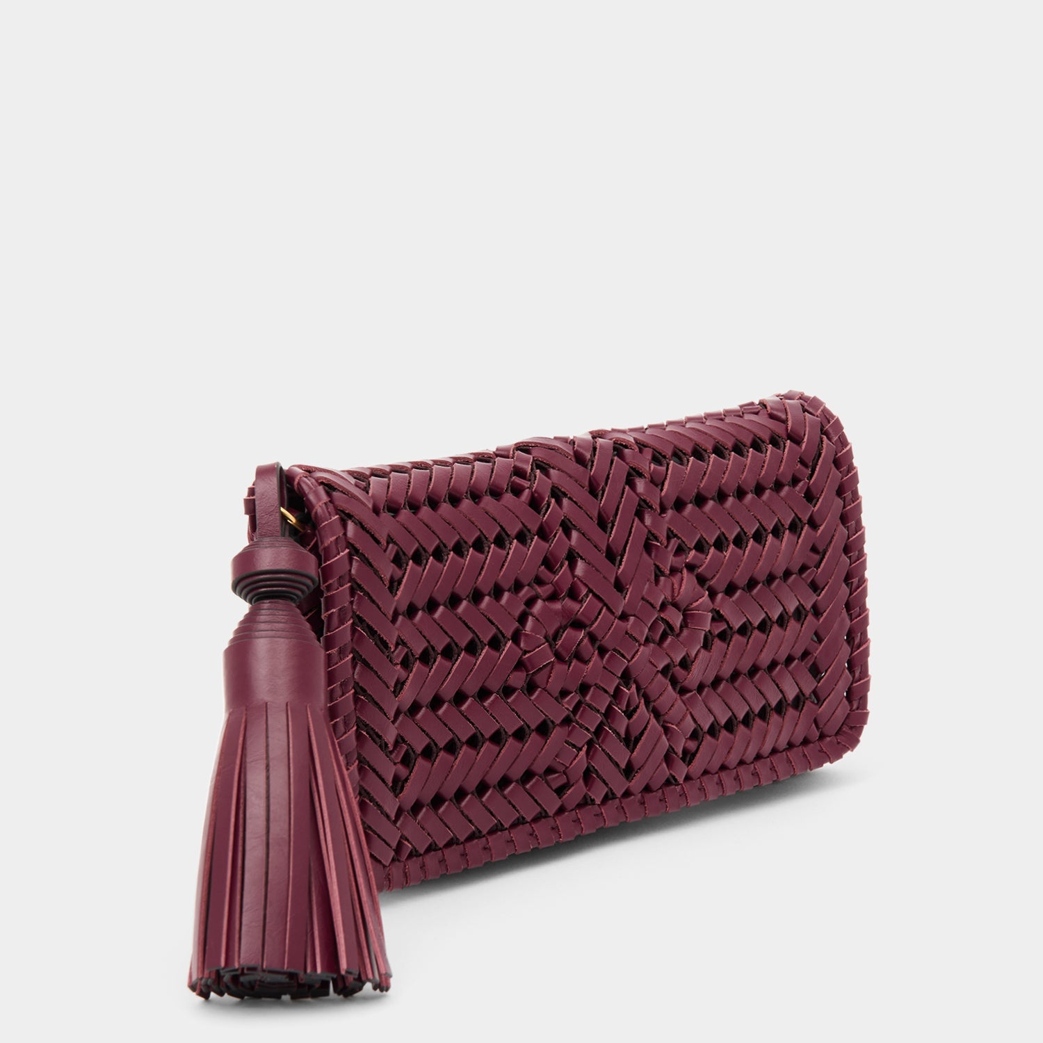 Handwoven leather clutch with adjustable strap by Anya Hindmarch