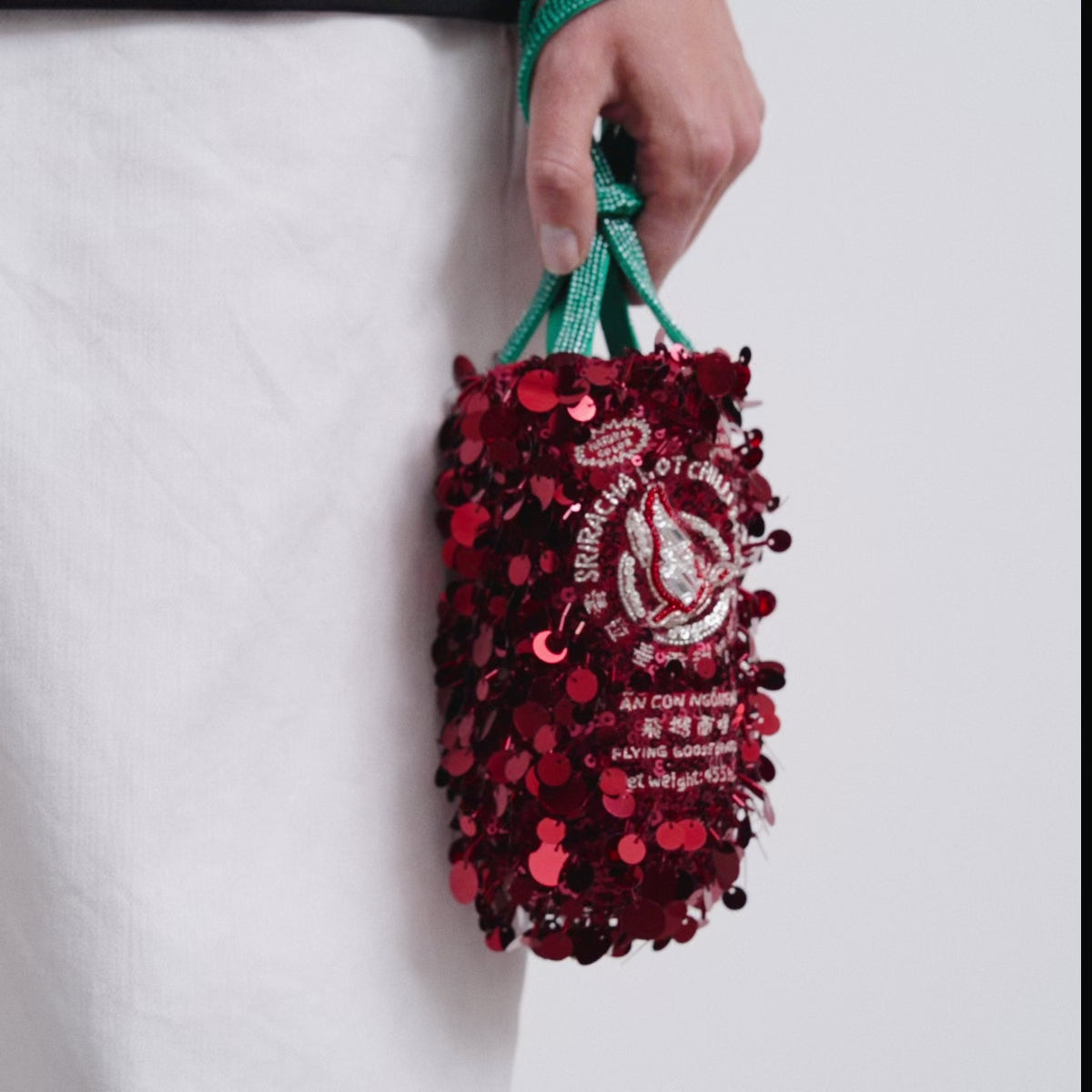 Anya Brands Flying Goose Sriracha Mini Bucket Bag -

          
            Satin/Sequins in Oxblood Red -
          

          Anya Hindmarch US
