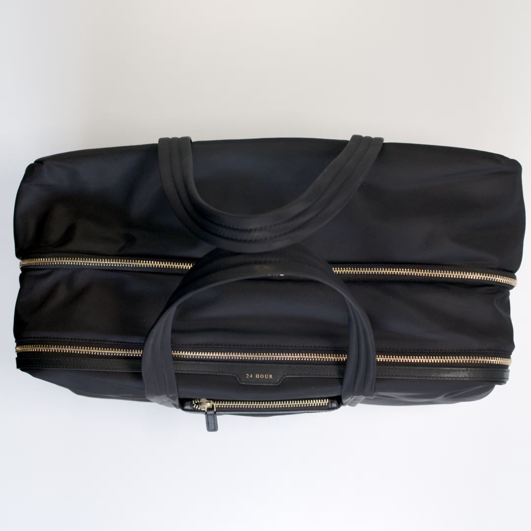 24 Hour Travel Bag -

          
            Econyl® Regenerated Nylon in Black -
          

          Anya Hindmarch US
