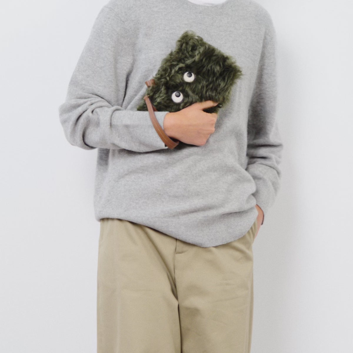 Shearling Eyes Clutch -

          
            Shearling/Smooth Leather in Khaki Green -
          

          Anya Hindmarch US
