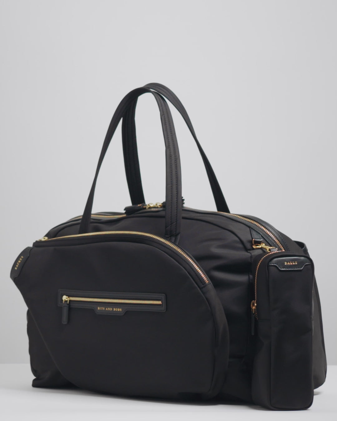 Tennis Bag -

          
            Econyl® Regenerated Nylon in Black -
          

          Anya Hindmarch US
