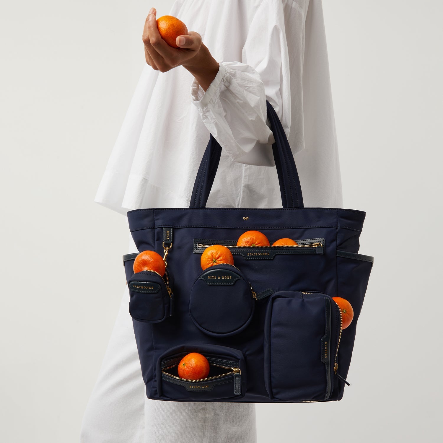 Commuter Tote -

                  
                    Regenerated ECONYL® in Marine -
                  

                  Anya Hindmarch US
