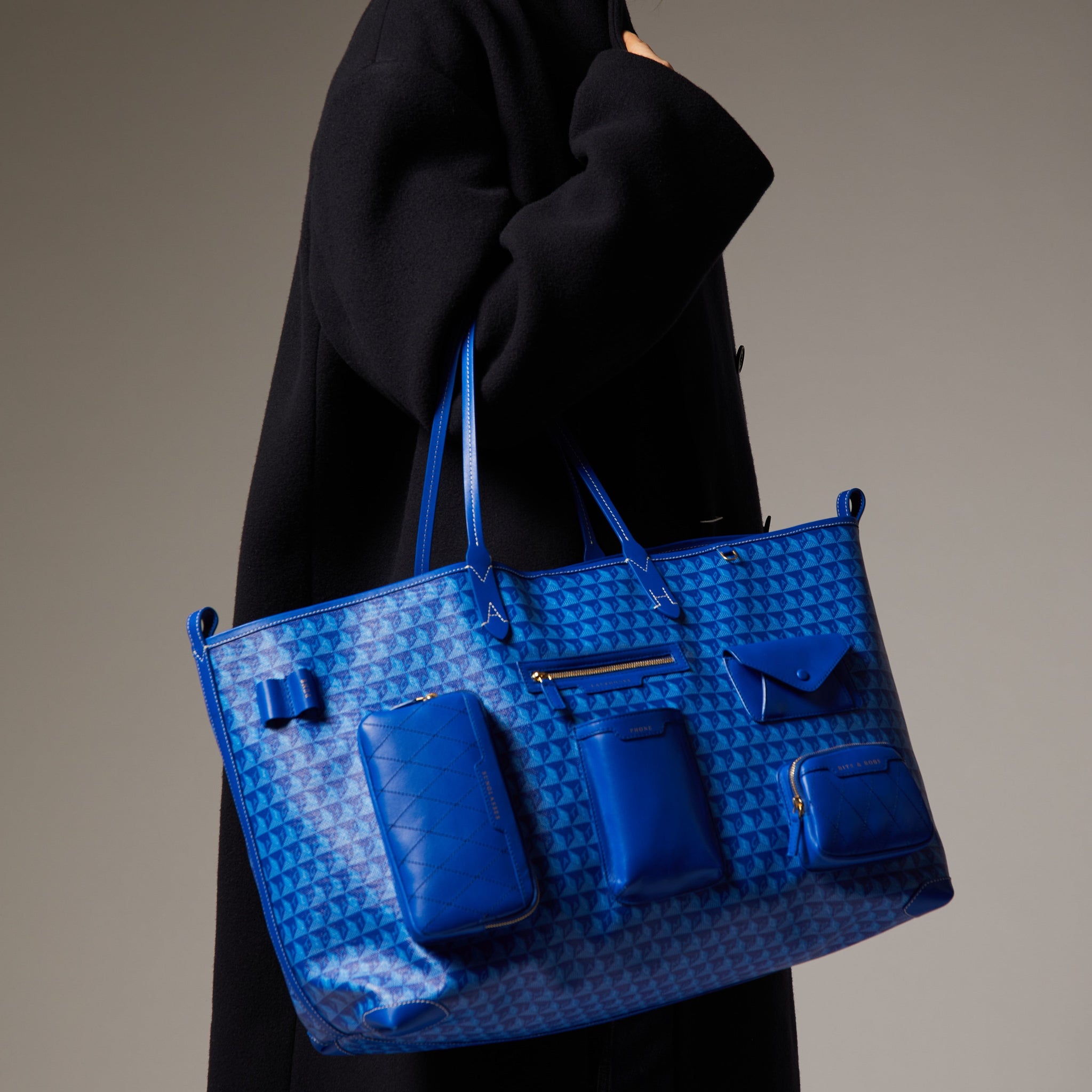 I am a Plastic Bag XL Multi Pocket Tote -

                  
                    Recycled Canvas in Electric Blue -
                  

                  Anya Hindmarch US
