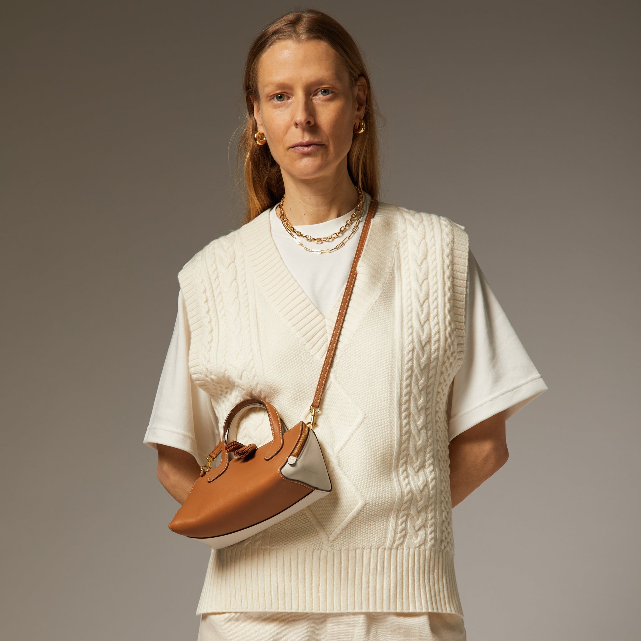 Small Wedge Cross-body -

                  
                    Calf Leather in Pecan/Chalk -
                  

                  Anya Hindmarch US
