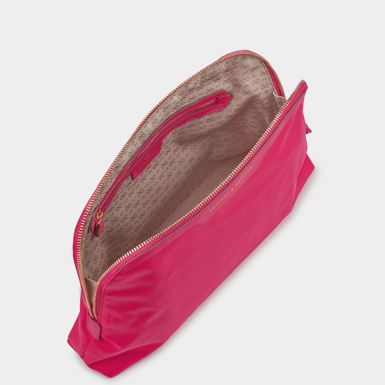 Lotions and Potions Pouch -

                  
                    ECONYL® in Hot Pink -
                  

                  Anya Hindmarch US
