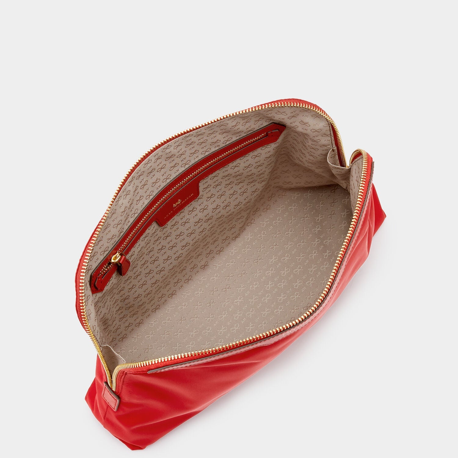 Lotions and Potions Pouch -

                  
                    ECONYL® in Red -
                  

                  Anya Hindmarch US
