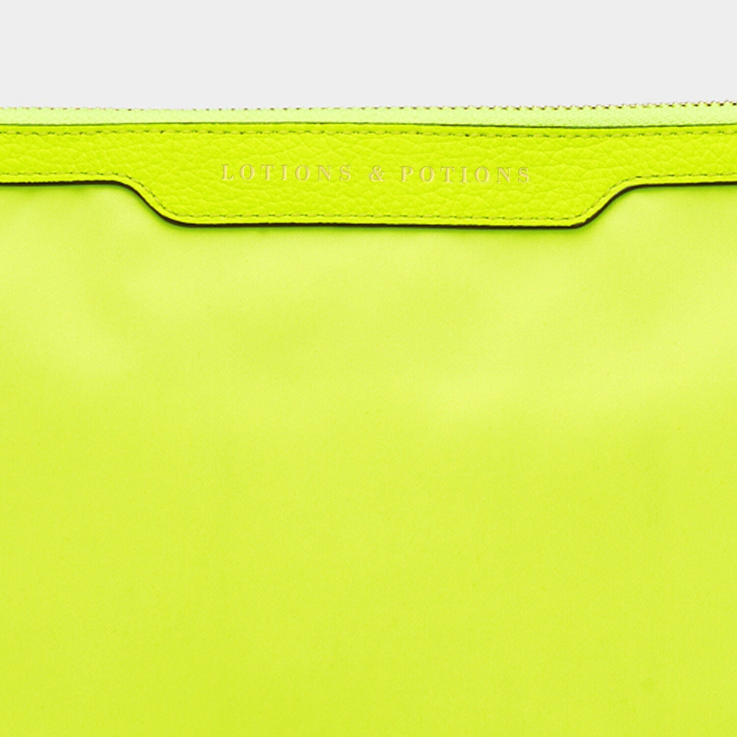 Lotions and Potions Pouch -

                  
                    Econyl® in Neon Yellow -
                  

                  Anya Hindmarch US
